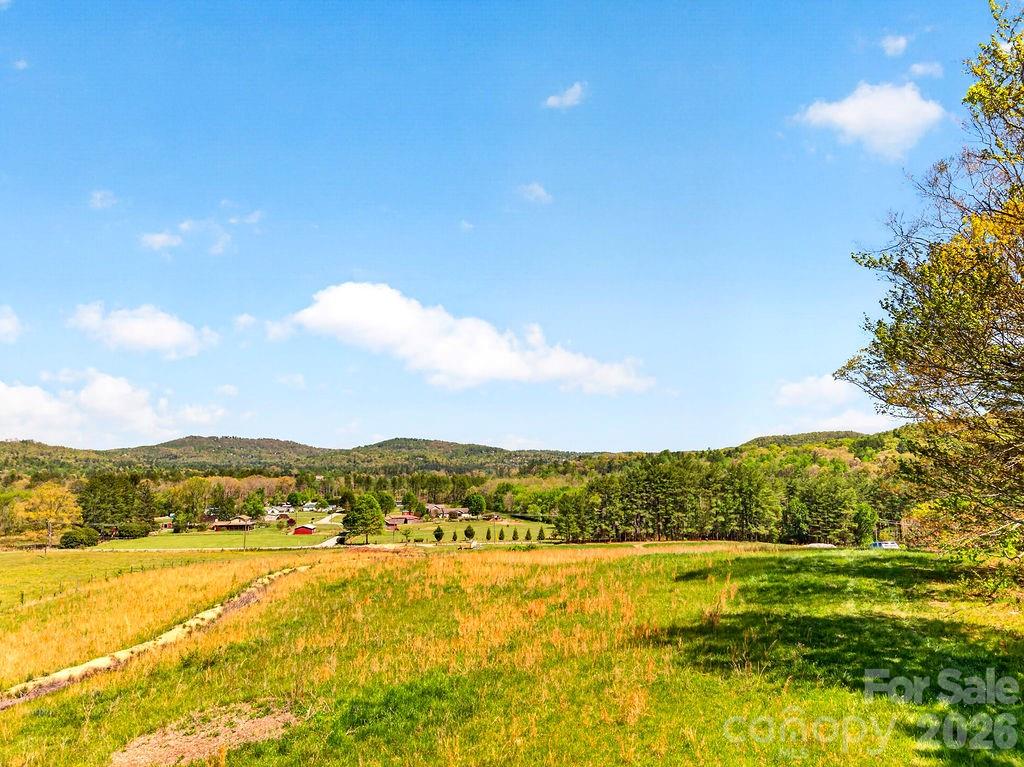 Beautiful 10-acre property featuring frontage and stunning views of the French Broad River, with long-range mountain views toward Laurel Park. This unique offering includes private river access and endless potential for development, private estate, or farming. A rare opportunity to own a peaceful and versatile piece of Western North Carolina land with both natural beauty and investment potential. Call for more information.