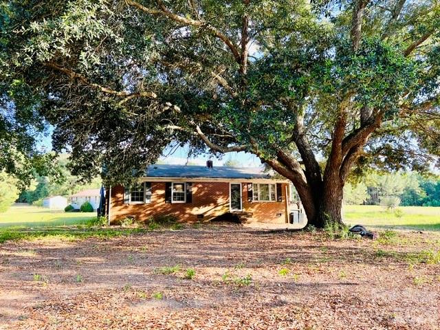 AS-IS Fixer upper, no repairs will be made by seller.  This 3 bed/1 bath all brick home on half an acre is waiting on it's next owners to make this house, a home!
