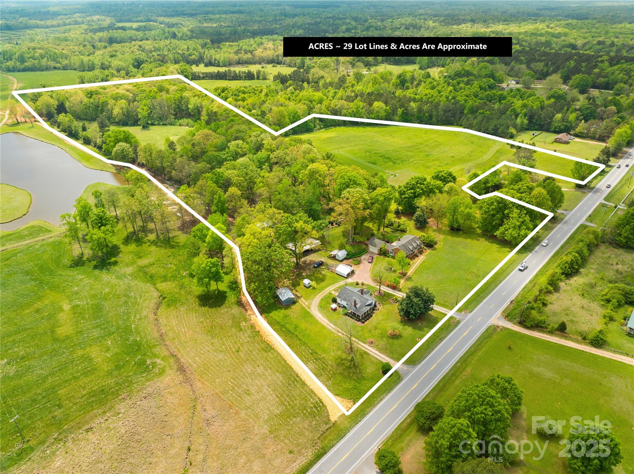 Equestrian Estate-29 Acres with 2 Homes, Barn, & multiple Pastures! Rare opportunity to OWN a beautifully maintained horse / farm property! This ONE-of-A-kind estate features 2 separate Homes, 2 fenced pastures, medical past., barn, multiple outbuildings (hot&cold water & electric) & climate-controlled greenhouse—Ideal for equestrian enthusiasts or those seeking a serene, multi-use homestead. The Main Brick residence includes a finished half-basement, custom built-ins, generous living spaces, & ample storage. Fresh carpet in many rooms, new blinds & NEW updated kitchen! Additional features include LUSH landscaped gardens with rolling open land with room to expand. Are you looking to run a working horse farm or simply enjoy the peace & beauty of rural life, this property checks every box! The 2nd home-4910 Pageland Hwy-1,362 sq. ft., 2Beds, 2 baths—ideal for guests, extended family, or rental income $$. Close to Buford High School, Buford Battleground Park & 30 miles from Charlotte! Hi!