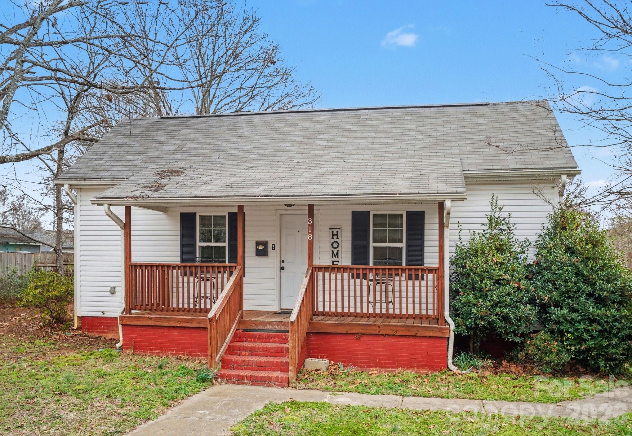Step inside this charming 1917 home in the heart of the Historic Mill District, where timeless character meets everyday comfort. From the moment you enter, you’ll appreciate the 10-foot ceilings, beautiful crown moldings, and a blend of LVP floors, tile, and carpet that preserve the home’s charm. The spacious, light-filled living room offers a warm and welcoming atmosphere, while the large eat-in kitchen features abundant cabinetry and a generous dining area complete with a cozy fireplace — perfect for gathering with family and friends. The primary bedroom suite includes a walk-in closet, and two additional bedrooms provide flexibility for guests, a home office, or hobbies.
Enjoy relaxing mornings on the inviting front porch or entertain outdoors on the wooden deck with mostly new decking boards. The fenced backyard includes a large storage shed for added convenience.
Located just minutes from downtown Mooresville, you’ll have easy access to shopping, dining, entertainment, I-77, and nearby hospitals — making this home as practical as it is charming.
