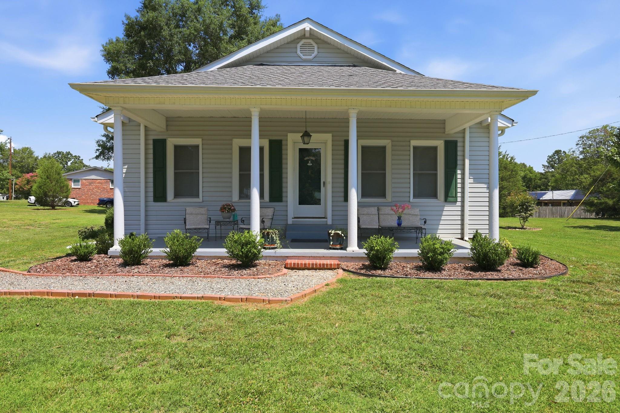 Located in a quiet neighborhood full of timeless charm, this adorable 3-bedroom 1-bath cottage, surrounded by a perfectly manicured flat half acre, is beautifully maintained and move-in ready. Features include 9-foot wood ceilings, heart of pine throughout, and pristine original 1946 hardwood floors. Three gas fireplaces add warmth and character, while the functional kitchen is designed for everyday living. Enjoy the covered back deck overlooking the beautifully maintained yard, plus the convenience of a two-car carport and two well-maintained storage sheds that convey. Charming curb appeal and classic details make this a home you'll fall in love with from the moment you arrive.

See attached feature list!
Backup generator powers the sump pump only.