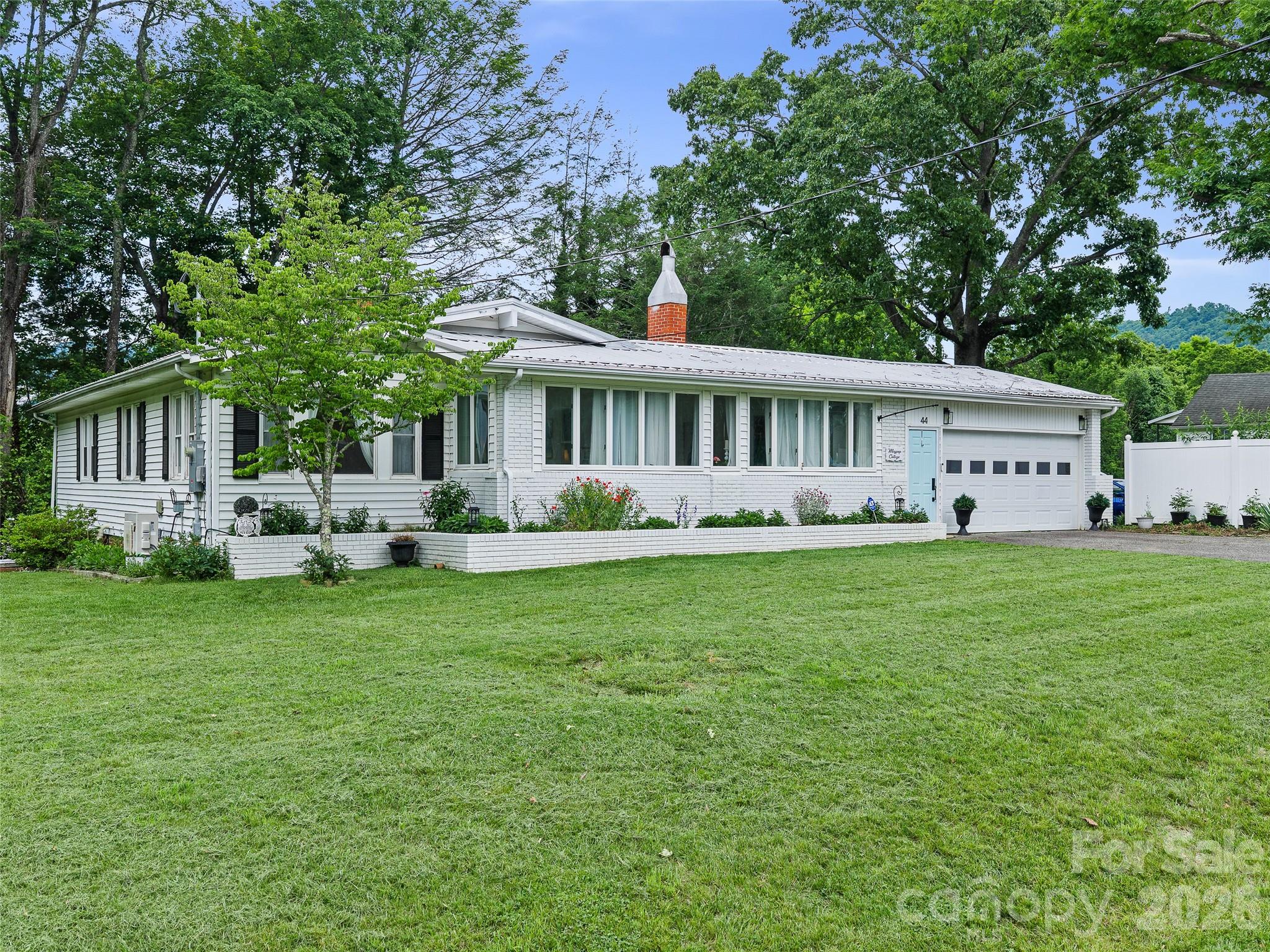 Filled with character and timeless charm, this 3-bedroom, 2-bath brick ranch offers the perfect blend of vintage appeal and modern updates. Located within the city limits of Spruce Pine, this inviting home features beautiful hardwood floors throughout, adding warmth and elegance to every room.
The spacious floor plan includes a formal dining room, an enclosed porch perfect for enjoying your morning coffee, and a large back deck ideal for cookouts and entertaining. An attached garage adds convenience, while the full heated and cooled basement provides endless possibilities for additional living space, hobbies, crafts, a home office, or recreation area.
With its classic brick exterior, vintage charm, and desirable location close to shopping, dining, and local amenities, this home is a rare find that offers comfort, character, and versatility.