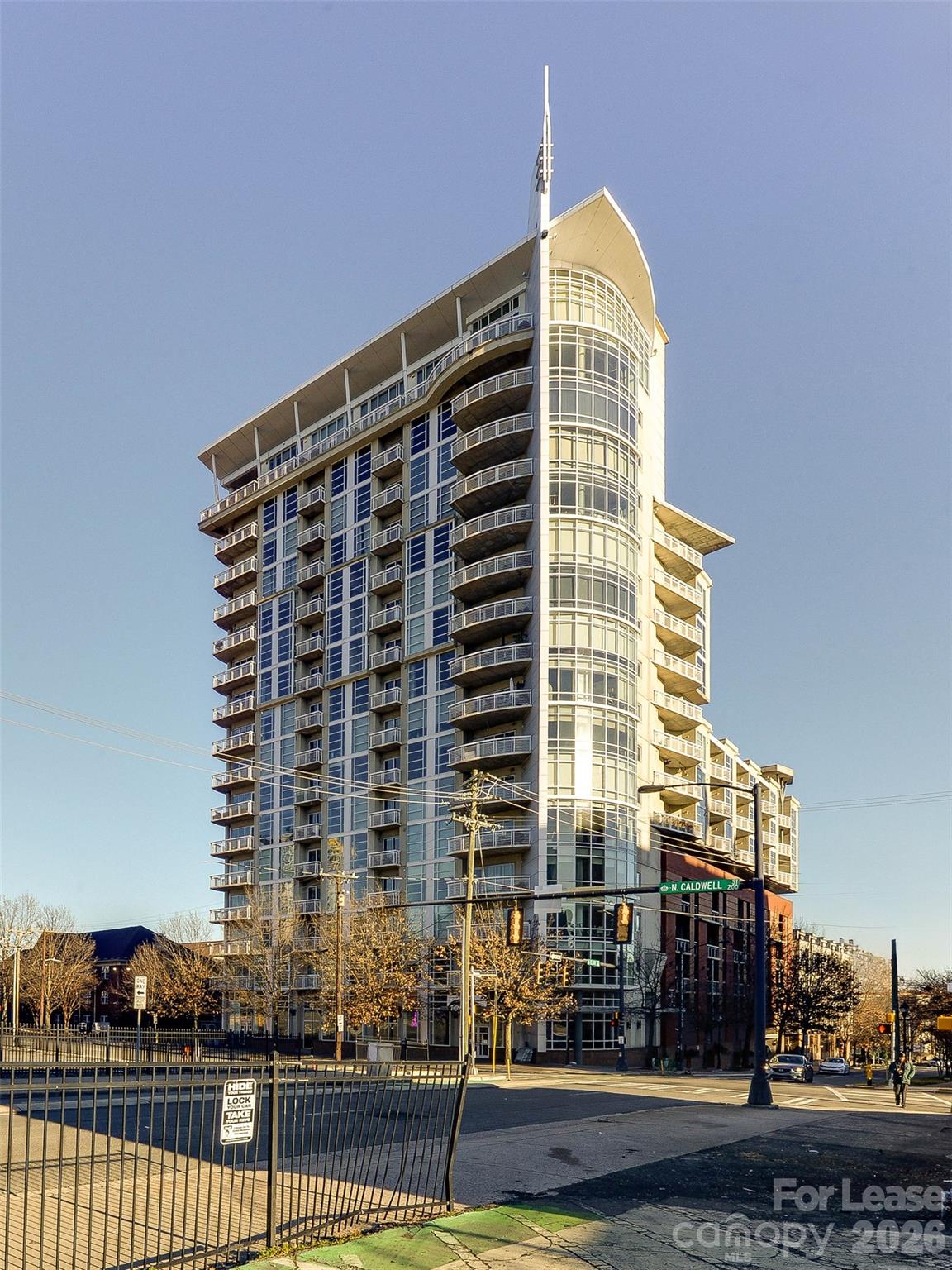 Excellent and newly renovated Uptown 8th floor condo in the Courtside complex.  Live in the heart of it all and be seconds to nightlife, great restaurants, dining, shopping and parks.  Across the street is the Spectrum center for events and concerts.  Take the secure entry elevator up to the 8th floor to get to this beautiful condo.  Hardwood floors, new carpet and custom finishes make this home shine.  The large bathroom and walk in closet are sure to please.  All appliances plus washer/dryer are included in the rent.  Enjoy the long range views out of the wall of windows leading to the large patio looking towards NoDa.  One secure parking spot is included too!  The building features a great location and a large roof top patio for entertaining.  Take a look today!