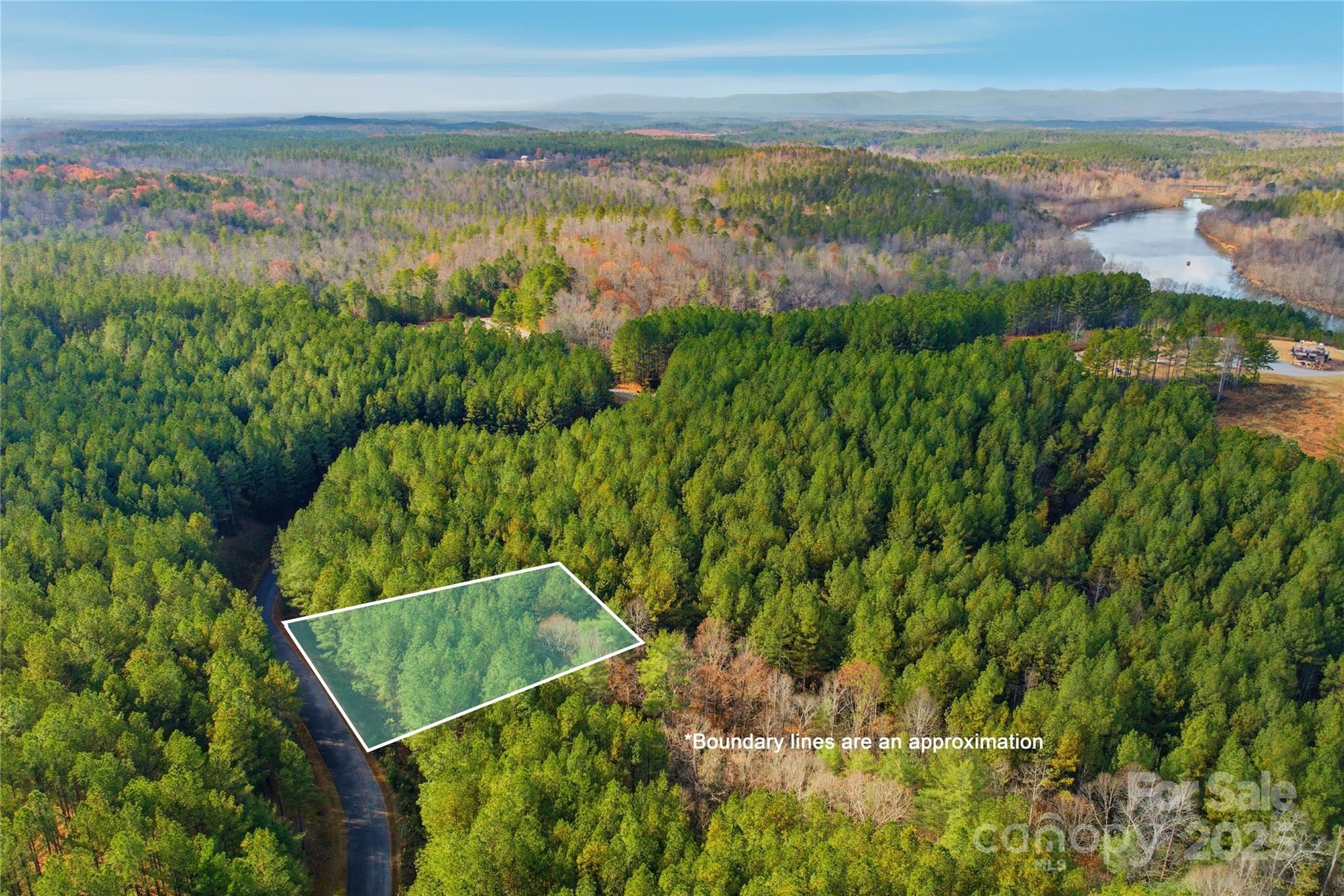 Discover the perfect place to build your dream home on this peaceful 0.47-acre lot in the gated community of Lake Rhodhiss Estates. Surrounded by rolling hills and mature forest, the property offers privacy and tranquility while still providing convenient access to city water, sewer, and underground utilities. Residents enjoy exclusive amenities including a scenic mountaintop pavilion, fire-pit gathering area, picnic space, and an upper deck with beautiful lake and mountain views. Architectural guidelines help maintain the community’s high standards, making it an ideal location for a full-time residence or a private retreat. Located just minutes from both Morganton and Hickory, the property offers easy access to shopping, dining, and entertainment. Lake Rhodhiss itself features roughly 90 miles of shoreline and invites year-round enjoyment with boating, fishing, kayaking, and other recreational activities. With its combination of natural beauty, serenity, and convenience, this lot offers an exceptional opportunity to create a custom home in one of the foothills’ most desirable lakeside communities. Schedule your showing today!
