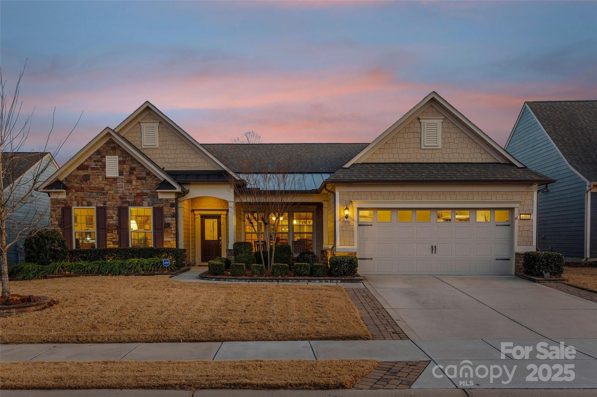 One level living at its finest! Tangerly Oak model in the Award-winning 55+ community of Carolina Orchards with over 100K in upgrades/options when built. Additional upgrades since home completion include a widened driveway, 2nd irrigation water meter, upgraded windows in Primary bedroom, 2-stage whole house water filtration system, Premium garage floor coating, a whole-house surge protector, a whole-house HVAC Purification system, just to mention a few. 
This 2BR 2.5BA + Office home has so much space to entertain. Both bedrooms considered Primary. Open concept living is centered around the upgraded kitchen w/ gas range. Living room has stone fireplace. Sunroom, screened porch, and patio all overlook the private .20 acres. Laundry room with passthrough to the Primary walk-in closet. 2 car garage w/ additional tandem golfcart garage make this a handyman/hobbyist dream. Lawn maintenance included. In this community, residents have access to a range of amenities tailored to an active & social lifestyle. This includes a clubhouse, fitness center, indoor & outdoor swimming pools, 4 tennis cts, 8 pickleball cts, bocce ball, dog park, playground, & various social activities to enjoy with like-minded neighbors. Community has on-site Lifestyle Coordinator! You don't want to miss this beautiful home in an amazing community!