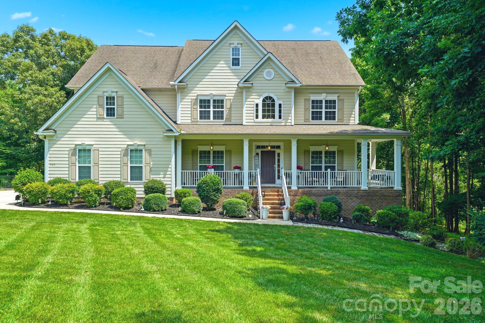 Welcome to 309 Walking Horse Trail, Davidson, a private retreat where nature, luxury, and comfort come together on a breathtaking 1.59-acre lot bordered by a peaceful natural creek. From the moment you arrive, the long private driveway and charming wraparound porch create an inviting first impression. Impeccably maintained and nestled among mature trees, this dreamy property offers nearly 4,600 square feet of beautifully designed living space with 5 bedrooms, 4.5 baths, soaring two-story living areas, and a fully finished basement.
The spacious lower level features a second family room and generous living quarters, making it ideal for an in-law suite, multi-generational living, or hosting family and friends. The luxurious primary suite provides a relaxing retreat, while the stunning screened porch overlooks the serene backyard, towering trees, and tranquil creek, perfect for morning coffee or evening unwinding.
Additional highlights include new carpet (2026), a tankless water heater, abundant storage, and room for everyone to spread out and enjoy.
If you’ve been searching for privacy, peaceful surroundings, and exceptional space just minutes from the charming and buzzing downtown Davidson, this immaculately maintained home is a rare opportunity.