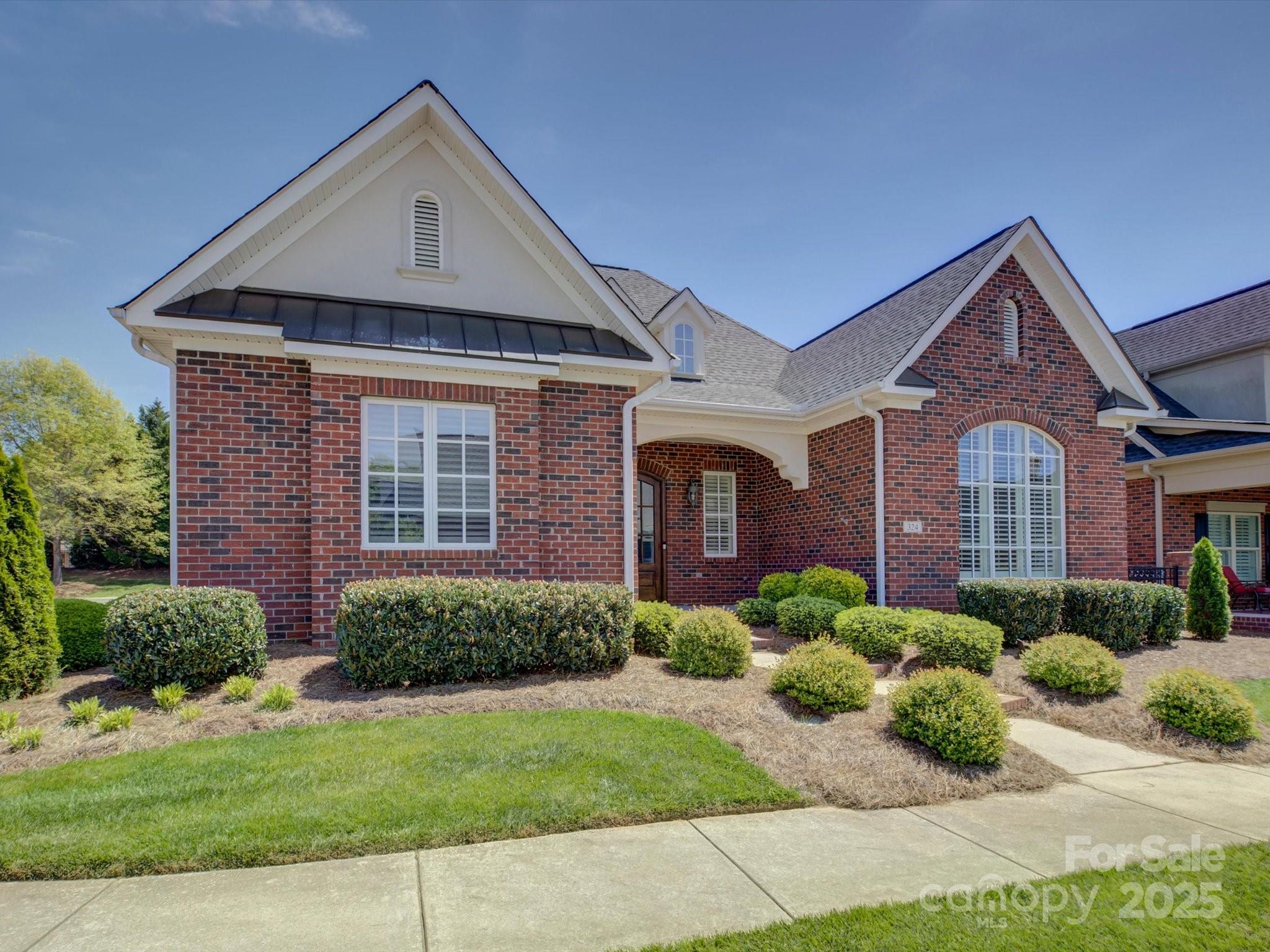 Welcome to this beautifully crafted, custom-built ranch home, designed for both comfort and elegance. As you step inside, you're greeted by soaring ceilings that enhance the openness of the living space, creating an inviting and airy atmosphere. This home features a thoughtfully designed layout with a spacious primary suite. The primary bath is a true sanctuary, featuring heated travertine floors, a luxurious soaking tub, and a walk-in shower. Two additional bedrooms share a convenient Jack-and-Jill bath. The heart of the home is the chef’s kitchen, boasting custom cabinetry, double islands, and a double oven, making it perfect for entertaining and meal prep. The open-concept design flows seamlessly into the living and dining areas. Upstairs, you'll find a large bonus space with a wet bar and a half bath for guests. Relax and enjoy the serene gardens and the screened-in back porch. With its high-end finishes, functional layout, and timeless design, this home is a true gem.