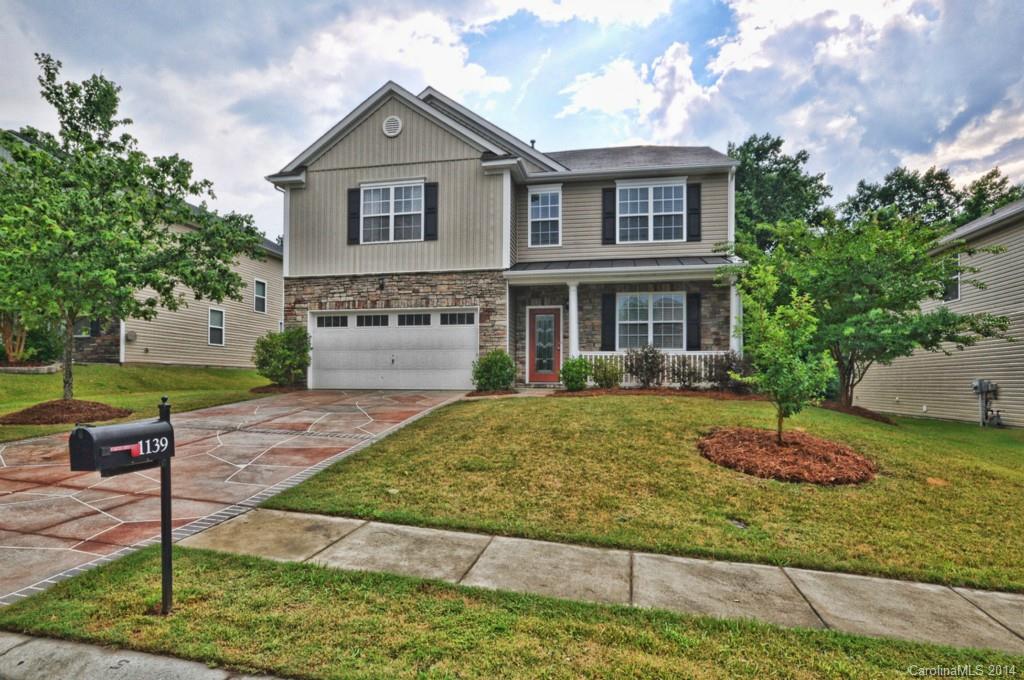 Spacious 3200 square feet of living space.  features:  granite countertops, Stainless Appliances, fresh paint  new carpet upstairs, new  laminate floors on main level.  Mastersuite: His & Hers  closets, dual sink vainity, garden tub, accent mirrors, custom lighting.    Large eat in kitchen   Exterior:  arbored  deck &  patio backs to greenspace. Community offers walking trails and park.  All information must be verified by buyer's agent including school assignments.