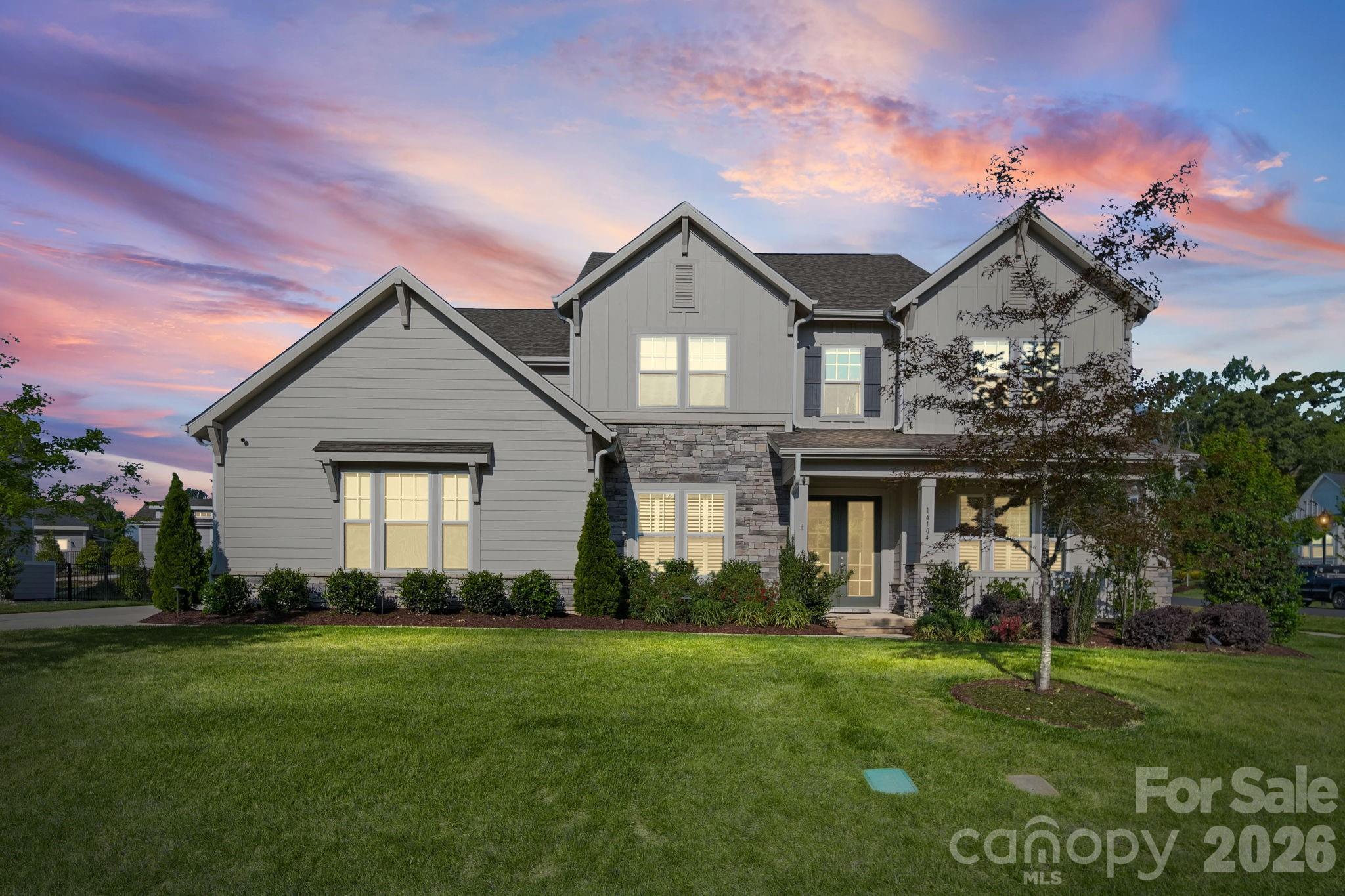 SELLERS WILL ENTERTAIN OFFERS BETWEEN $1,329,900.00-$1,379,900.00 OR ABOVE. This Gorgeous Custom Built Home is Situated on a Professionally Landscaped corner lot. Enter the home through the 8 Ft French Doors and you are Greeted with an Open Floor Plan that caters to an Entertaining Lifestyle. You will notice a Large Formal Dining Room off The Foyer as you make your way to the Huge Great Room Featuring a Custom Coffered Ceiling, Gas Log Fireplace, Lots of Windows with Custom Blinds, and Open to the Beautiful Gourmet Kitchen. The Kitchen is a Chefs Delight as it Features Custom Cabinets, Quartz Counter Tops, Custom Tile Back Splash, Stainless Appliances, FarmHouse Style Sink, Gas Cooktop with a Stainless Canopy Style Hood Vent, and Dual Islands with Eat-In Bar. As you enter the Dining Room from the Kitchen you will pass by the Beautiful Butler Pantry and the Powder Room is near for easy by your guests. The small Office/Computer Niche Room off the Kithen Features Built in Cabinets across from the Large Walk-In Pantry. The perfect area for planning meals or sorting mail so as to keep the Kitchen Free of Clutter. This Perfect Floor Plan Features a Main Level Bedroom En-Suite. The Huge Owners Suite is located on the Upper Level Featuring a Sitting Area and a Beautiful Glamour Private Bathroom with His and Hers Separate Vanities and His and Hers Separate Walk-In Closets. The upper Level also Boasts 3 other Guest Bedrooms, One of which is an En-Suite with Private Bath. The other 2 have Access to The Jack and Jill Bath. The upper Level also has a Laundry Room with Built in Cabinetry and Includes an almost New LG Washer and Dryer. The Large Bonus Room Features many Windows with Custom Blinds and a Wet Bar with space for a Beverage Wine Cooler. The Covered Wrap Around Rear Porch Features a Floor to Ceiling Outdoor Stone Gas Log Fireplace and Overlooks the Professionally Landscaped Rear Yard. There is Also a Large Stone Paver Patio off the Rear Covered Porch Area. The Home Comes with a Water Filtration System and a Tankless Water Heater. One of the Greatest Benefits of this Wonderful Home is the very hard to Find 4 Car Garage. Lots of room for Cars and or a Workshop. The Seller has placed a Home Warranty on the Home which will cover the home for 1 Year from date of Closing to give Buyers Peace of Mind.