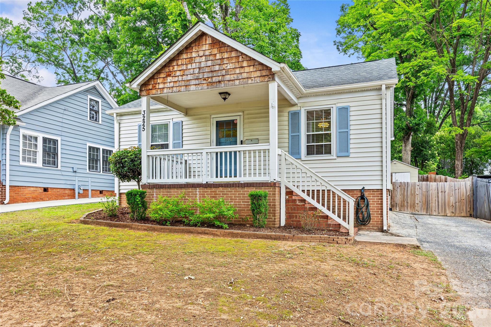 Welcome to 3225 Commonwealth Ave — a charming bungalow nestled in the heart of sought-after Commonwealth Park. Inviting covered front porch. Step inside to warm hardwood floors flowing throughout the home. The large, bright living room offers plenty of space to gather or lounge!

The updated kitchen shines with freshly painted cabinets, new tile backsplash, modern lighting, crown molding, and durable tile flooring. This space opens seamlessly into a dining area featuring custom bench seating, perfect for gatherings and everyday comfort. A dedicated laundry area offers additional storage and newly installed doors for a clean, finished look.

The home includes a comfortable primary bedroom, a second bedroom, and a beautifully updated hall bath complete with a newly tiled shower with new glass door, updated vanity, and stylish tile flooring.

Step outside to a fully fenced backyard — an ideal space for entertaining, gardening, or relaxing. Enjoy the deck for outdoor dining and take advantage of two storage sheds for all your tools and hobbies.

Just minutes from everything Plaza Midwood has to offer!