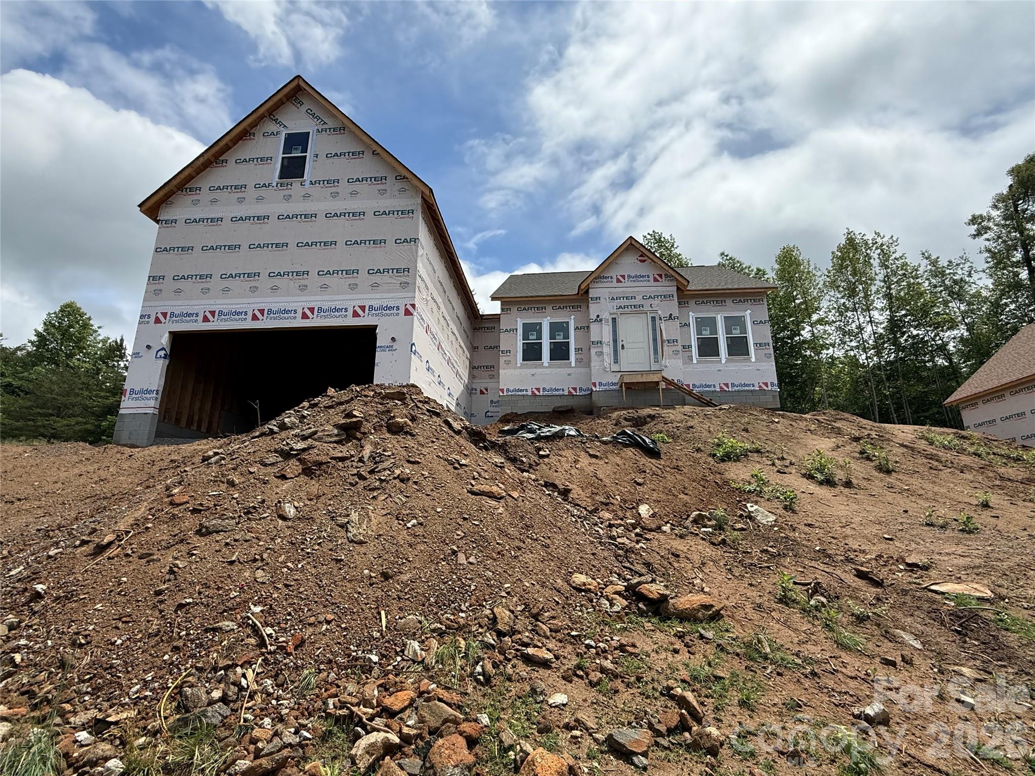 Welcome to this stunning new construction home nestled in the desirable Huntington Woods neighborhood. This beautiful property boasts an inviting curb appeal and is surrounded by breathtaking mountain views that enhance the charm of the area. Conveniently located just off Highway 321, you’ll enjoy quick access to Boone, Blowing Rock, and Hickory, making it perfect for both everyday commuting and weekend getaways. Local shopping and a variety of restaurants are just a stone’s throw away, adding to the convenience and lifestyle this location offers. With its modern design and thoughtful layout, this home is ready to meet all your needs while providing a tranquil retreat in a sought-after community. Don't miss the opportunity to make this exceptional property your own!