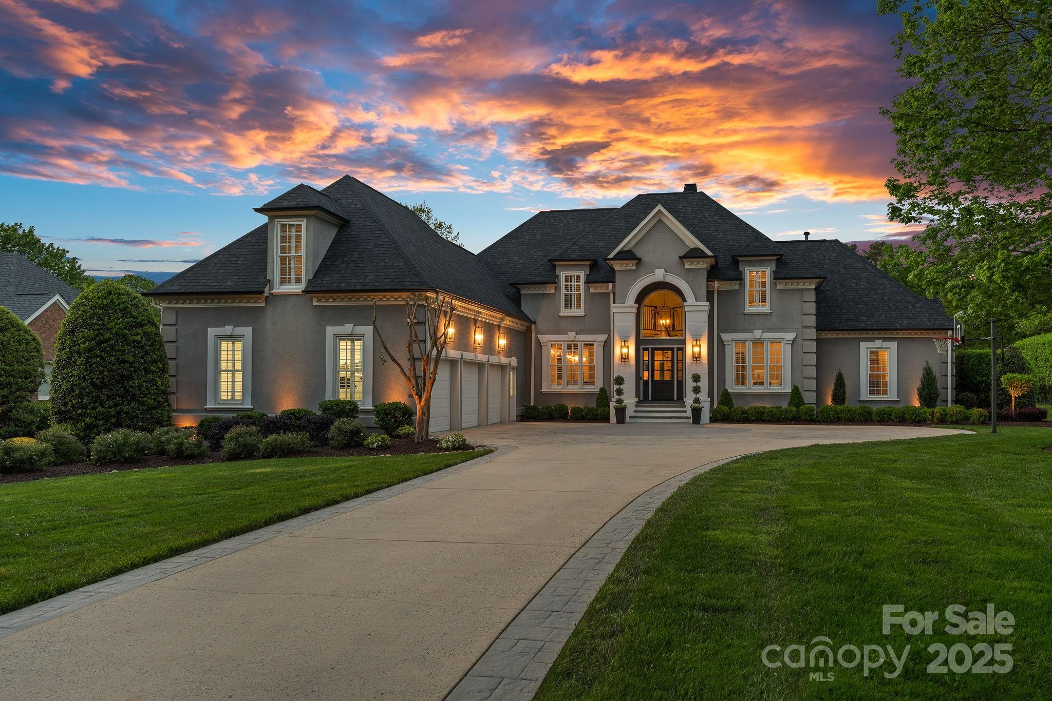 Stunning Turnkey Golf Course Estate with Designer Finishes! Located just steps to The Peninsula Golf Club, this gorgeous property offers the ultimate in luxury living and timeless design. Nestled on a generous, meticulously landscaped lot, the nearly 7,000 sq ft home features 6BRs and multiple living & entertaining areas. Styled in elegant Restoration Hardware-inspired finishes, the main level showcases a designer kitchen, open floorplan and sunlit living room with serene golf course views. The expansive primary suite is a true retreat, complete with sitting room, spa-like bath, and generous walk-in closets. The fully finished basement, a showstopper featuring trey ceilings, sleek bar area, BR & BA, gym, and temp-controlled wine room perfect for entertaining. Outside, enjoy the heated saltwater pool and cozy outdoor fireplace. 3-car garage, newer roof & systems for peace of mind, and beautifully manicured grounds that offer both privacy & curb appeal. Resort-style living at its finest!
