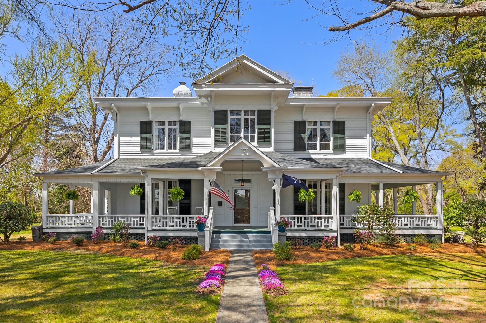 Experience the timeless charm and character of owning a piece of history. Nestled on nearly 3 private acres in the heart of York's Historic District, this iconic home offers more than just square footage—it offers a lifestyle. Stroll under century-old trees, garden in sun-dappled spaces, or simply relax on one of the grand porches as life slows down around you. With its architectural details, high ceilings, handcrafted finishes, and rich history, every room tells a story. Enjoy the rare blend of historic elegance and modern updates, with plenty of room to spread out both inside and out. Whether you dream of hosting garden parties, creating a private retreat, or investing in a legacy property, this home invites you to live with intention and grace. Historic living, generous land, and timeless beauty—this is more than a home; it’s a way of life. All fireplaces closed and sold as-is.Lot 0700212023-0.44ac included. Ask for video tour.