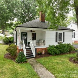 Welcome home to this beautifully updated charming mill home located across the street from Village park ( train, carousel, YMCA, splash pad, and summer concerts), and half a mile to the newly revitalized downtown of Kannapolis offering Atrium baseball stadium, breweries ,restaurants, boutiques, and The Swanee Theatre. Step inside this 3-bedroom, 1.5 bath home offering a comfortable layout designed for everyday living. The spacious bedrooms provide plenty of room for relaxation, while the half bath adds extra functionality for family and guest. Updates in 2024 include new kitchen cabinets, quartz countertops, and appliances quaintly finishing the eat in kitchen. Other updates in 2024 include refinished original hardwood flooring, paint, light fixtures , tile in bathrooms as well as new vanities, toilets, and shower tub combo with subway tile . Hot water heater, insulation, vapor barrier in crawlspace, attic fan, and gutters 2024. Concrete to garage, walkway to grill area, and outdoor patio 2024.  The beautiful landscaping provides a perfect canopy for gathering and entertaining family and friends. Whether you are taking a short stroll to local restaurants, breweries, shops, and entertainment venues or catching a baseball game, you will love the convenience of this sought after location. The finished 1 car garage and 8 x 10 wired storage building provide tons of extra space for storage , workbenches, and hobbies. First time home buyers that qualify can get up to $15,000 down payment assistance with Bruce Lawing at Novus Home Mortgage. The Seller is offering a 1 year warranty for peace of mind. Don't miss out on this opportunity to own a piece of Kannapolis history!