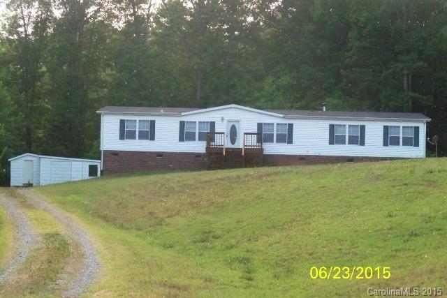 Listing agent is related to the seller. Large double wide mobile home with 5 bedrooms and 3 full baths. The home and outbuilding have a new roof. The home is selling with all appliances. The home has new paint, carpet, well pump and freshly stained porch and deck. The AC unit was replaced in 2013.  Call listing agent with any questions.