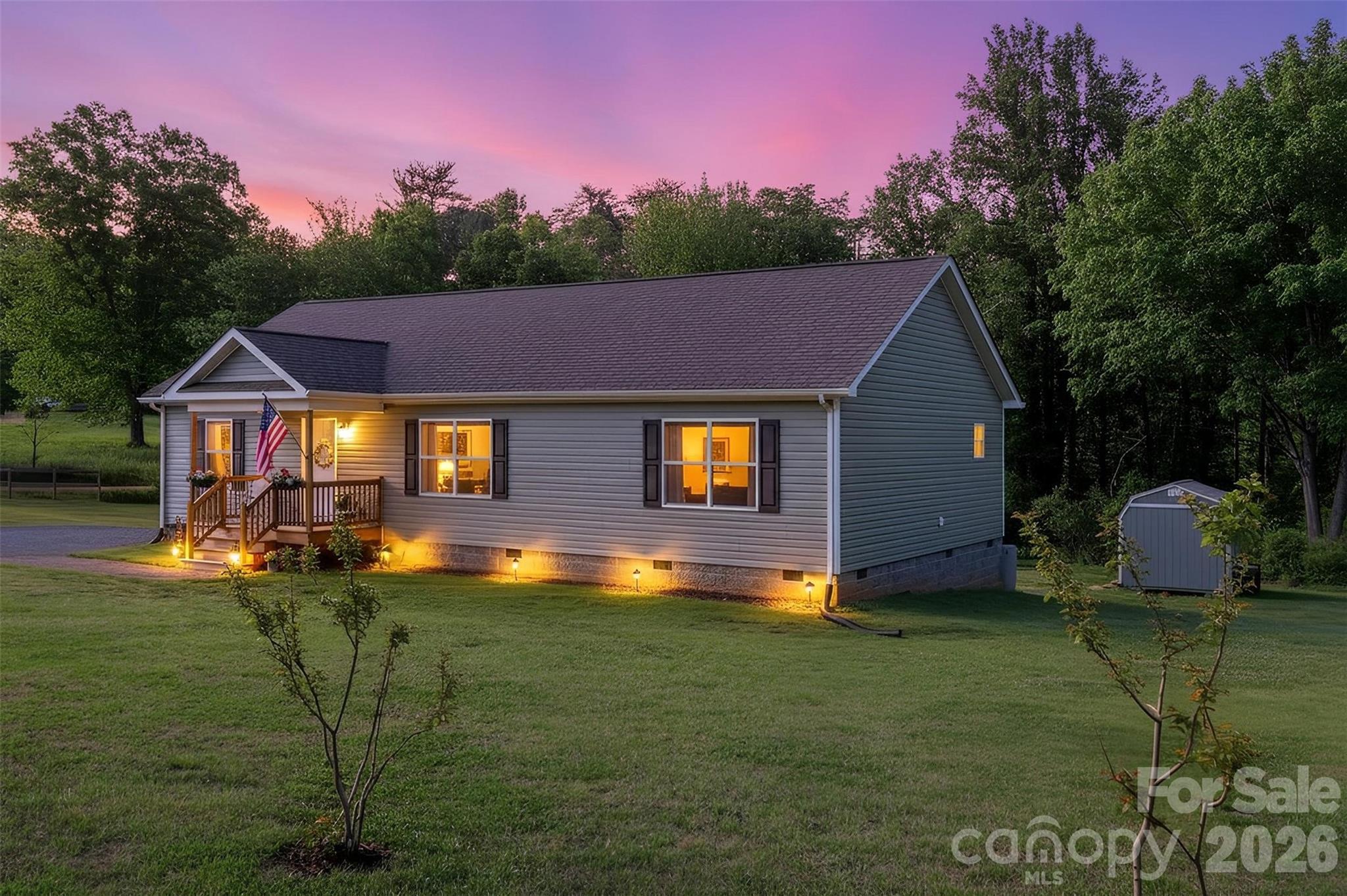 This lovely home is 3 years old and barely broken in.  Located on desirable George Hildebran School Road, it sits on almost 3 acres of unrestricted land. The home features 3 bedrooms and 2 bathrooms in a split bedroom plan.  The living area is open concept with plenty of space for the family.  The large back deck and covered front porch offer the perfect place to sit and enjoy the outdoors.  The large yard has plenty of room for chickens, gardening, or whatever you can dream up.  Need a place for storage, a she-shed or somewhere to keep the chicken feed?  The wired 10 x 16 Pineview outbuilding is barely a year old and stays with the property.  The yard has new apple and cherry trees as well as a beautiful border of purple crape myrtles along George Hildebran.  This "country living" is still convenient to Hwy 127, Hwy 321, Interstate 40 and Hwy 18.  If you love  the outdoors, Bakers Mountain Park and South Mountain State Park are nearby.  

This property is completely ready to move into.  The home was built in 2023 so there is peace of mind in knowing that the appliances, electrical, plumbing, roof and septic are less than 3 years old. All major appliances except the upright freezer convey.  

The adjoining 1.1 acre lot can be purchased alongside this property.  It is set up with county water, a septic system which was inspected in 2024, electricity, and a 30 amp RV hook up.  There is a separate gated entrance to the property.  

The 16 chickens and coop area are negotiable.  If buyer is not interested, the seller will remove and sow grass seed prior to closing.