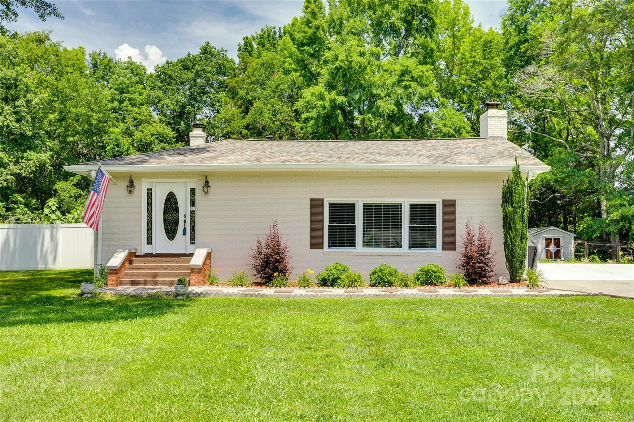 Nestled in a prime location near Hwy 161 and Mt. Gallant Rd, this charming full brick ranch offers the perfect blend of comfort and convenience. Featuring three spacious bedrooms and beautifully upgraded hall bath, this home boasts newer carpet and fresh paint throughout. The expansive living area is perfect for hosting large gatherings, while the upgraded kitchen caters to your culinary needs. Sitting on almost an acre, this lot provides ample space for entertaining and grilling on the outdoor patio, gardening, or even building a pool. All buildings convey and are wired with the exception of the metal building. Two wells ensure a reliable water supply, and the property includes two driveways for added convenience—one leading to a carport.