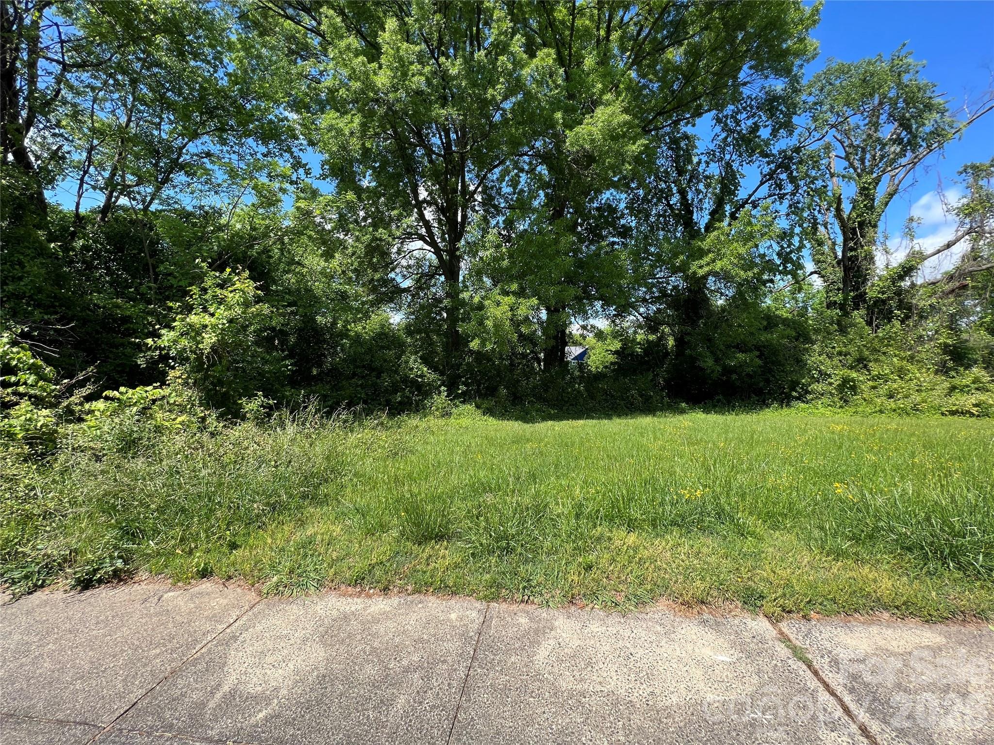 Tucked along Charles Avenue in the heart of Heirloom at Mattie Rose by Grandfather Homes, this homesite offers an opportunity to build a thoughtfully designed new home in NoDa’s most distinctive boutique community. Enjoy walkable access to NoDa’s dining, art, and entertainment scene while coming home to a quieter, more intentional residential setting. The streetscape emphasizes “right-sized” living with curated outdoor spaces, rooftop living potential, and energy-efficient construction. As the final lot available for a full custom build, this is a truly exceptional opportunity to create a one-of-a-kind home in a community defined by design, livability, and longevity.