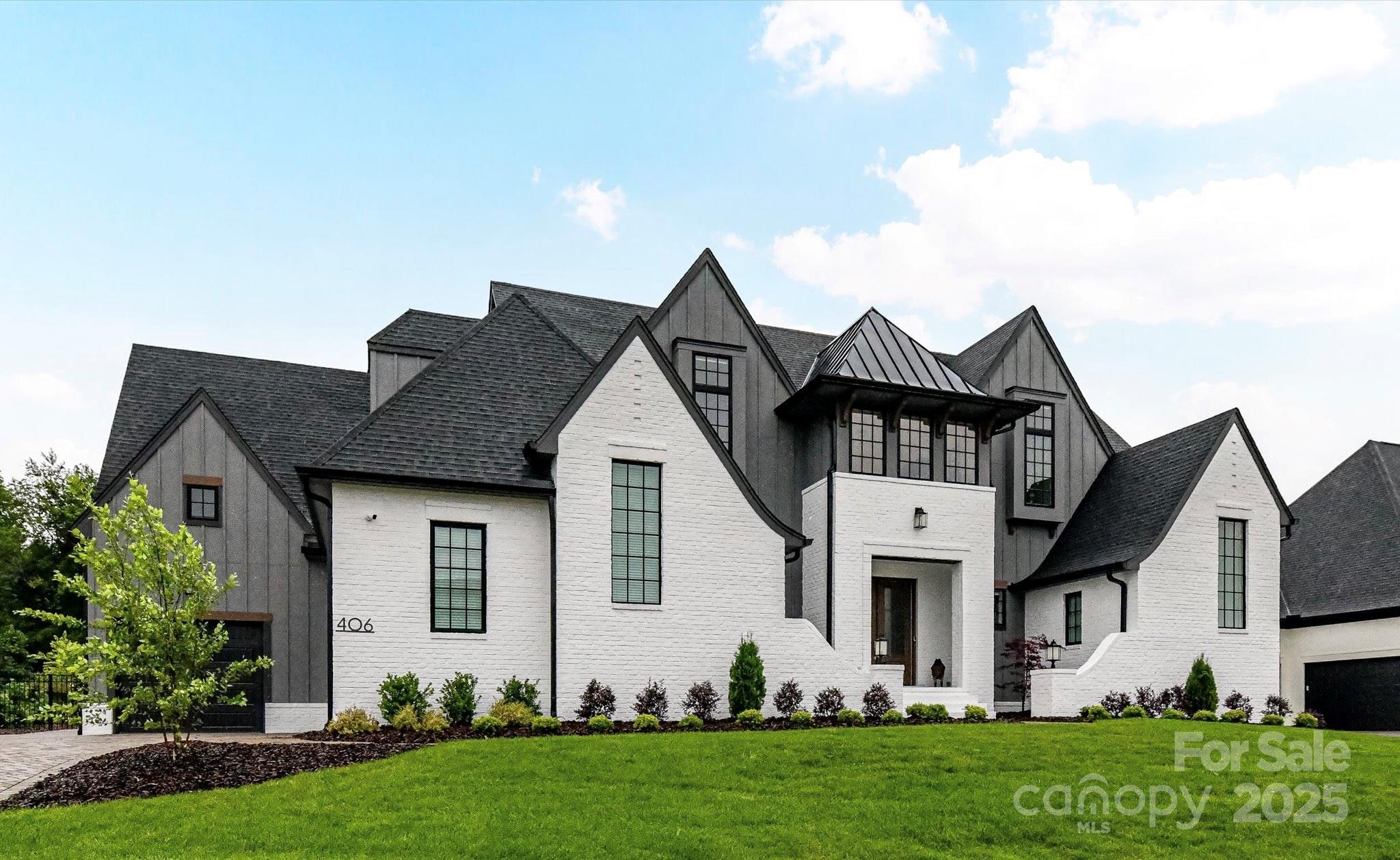 Discover elevated living in this stunning 6-bedroom, 5-bath, 5,085 sq.ft. Modern Tudor masterpiece where luxury and functionality blend seamlessly. From the moment you enter, every detail speaks to quality—custom Eudy’s cabinetry, Wolf/SubZero -Z-line appliances, triple ovens, and a full scullery second kitchen create an unrivaled culinary experience perfect for entertaining or everyday living.
The expansive layout offers thoughtful versatility with a dedicated home office, a spacious media room with full surround sound, and the convenience of both a primary suite and a private guest suite on the main level.
Step outside and experience your own $300K resort-style oasis—a 20x40 heated pool and spa, cabana with real stone wood-burning fireplace, and a fully equipped grill station with bar, all set within $100K of professionally designed landscaping that ensures total privacy and tranquility.
The oversized 3-car garage is designed for the enthusiast, featuring epoxy flooring, custom storage, and abundant space for organization.
Located in the highly sought-after Twin Lakes community, residents enjoy scenic walking trails, a waterfront gazebo, pickleball courts, and a community dock stocked with kayaks, canoes, and paddleboards. With Waverly, top dining, and I-485 just minutes away, this exceptional property redefines modern luxury living in one of the area’s most desirable neighborhoods.