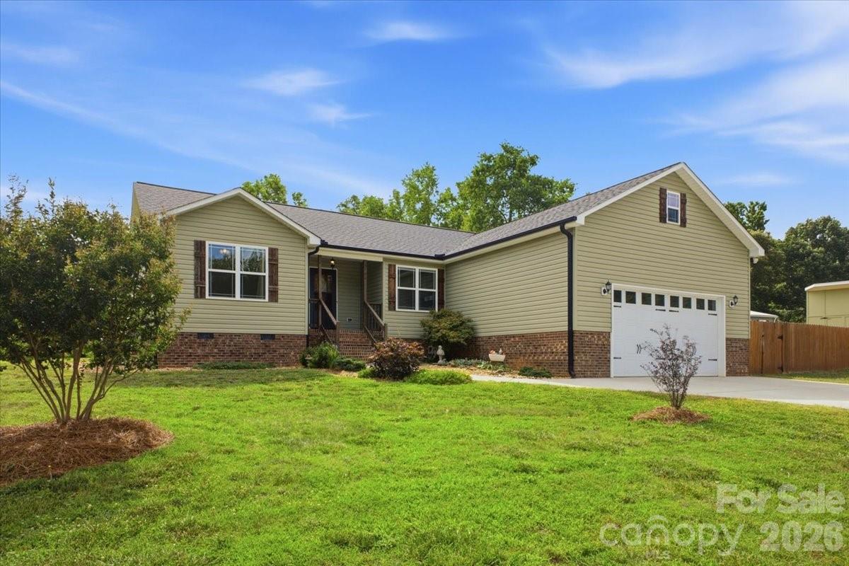 Welcome to 3788 Rene Road in Maiden, NC! This beautifully crafted 3-bedroom, 2-bath ranch home combines modern comfort with timeless charm. Situated on a generous 0.58-acre lot, with 6ft privacy fence this property offers the perfect blend of privacy, outdoor space, and convenience. Step inside to discover an open-concept floor plan highlighted by soaring vaulted ceilings, creating a spacious and inviting atmosphere perfect for everyday living and entertaining. Designed with quality finishes throughout, the home features beautiful wood floors that add warmth and character to the main living areas. The well-appointed bathrooms showcase stylish tile showers, providing both elegance and durability. The thoughtfully designed layout offers seamless flow between the living, dining, and kitchen areas, while the split-bedroom floor plan provides privacy and functionality. Just beyond the living area, the rear door opens to an expansive back deck and inviting outdoor living space, creating the perfect setting for morning coffee, weekend cookouts, entertaining friends and family, or simply relaxing while overlooking your spacious backyard. Outside, you'll be greeted by attractive green vinyl siding accented with custom-made shutters, creating exceptional curb appeal. A custom-built storage shed, designed to match the home, offers additional storage while maintaining a cohesive look throughout the property. Enjoy the freedom of No HOA and the convenience of being just minutes from the new Highway 16, providing easy access to Charlotte, Hickory, and surrounding areas. Located within the highly sought-after North Lincoln School District, this home delivers the perfect balance of peaceful country living and modern accessibility. Whether you're searching for your first home, looking to downsize, or simply want the ease of one-level living on a spacious homesite, 3788 Rene Road offers exceptional quality, desirable features, and a prime location in one of Lincoln County's most desirable areas.