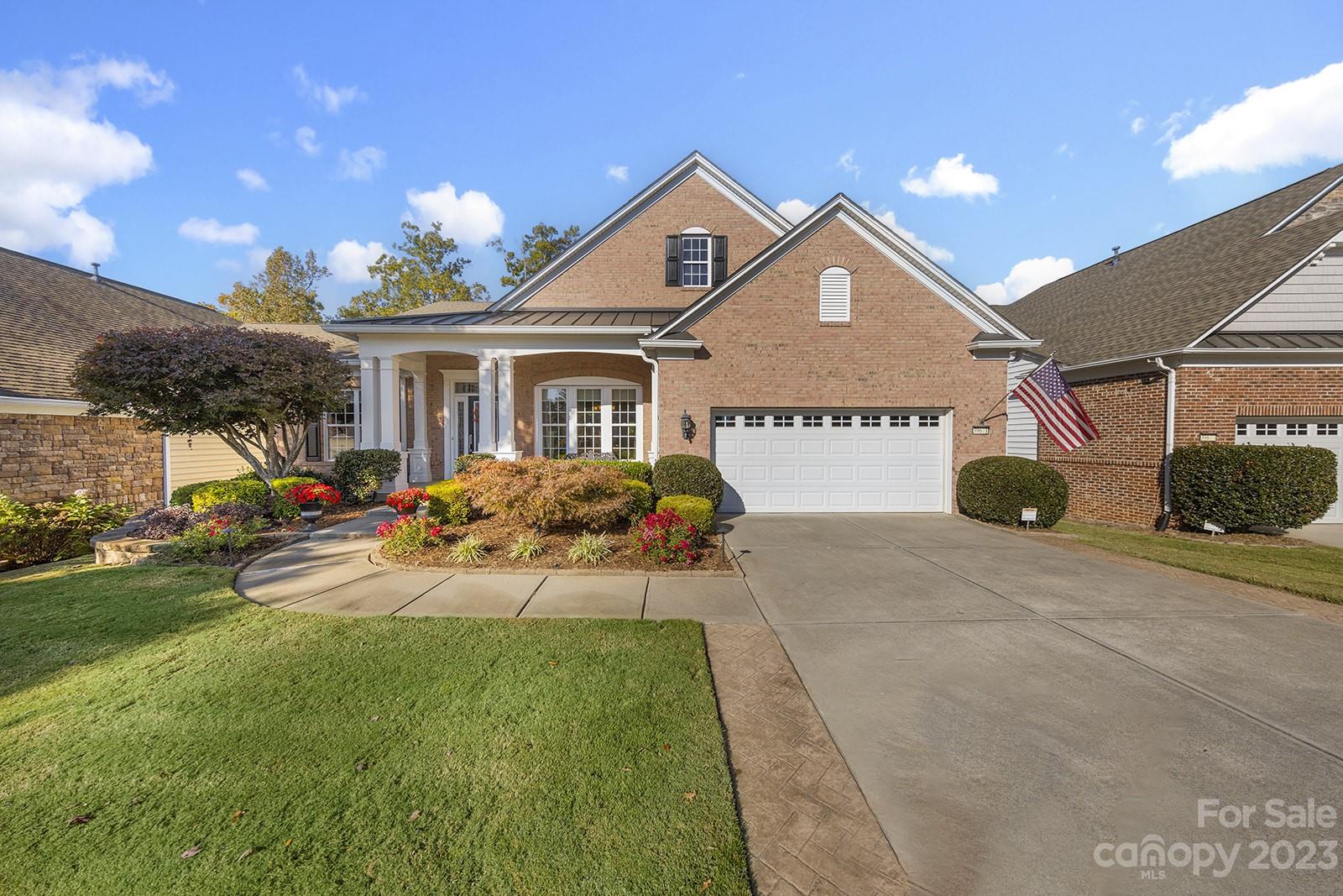 Beautiful Morningside Lane w/sunroom & finished walk out bsmt offers tons of space for entertaining visiting guests! Golf course lot w/seasonal water views on a quiet street. Kitchen features granite counters, tile backsplash, under/over cabinet lighting, SS appliances, large island, & a solar tube for extra natural light. Formal dining w/butler pantry is ideal for dinner gatherings. Relax in the great room w/the gas log fireplace & enjoy the surround sound, or in the sunroom w/dual fans & boasting natural light. Separate office for home management offers flex space. Primary suite w/tray ceiling, dual sink vanity w/granite counter, custom tile shower & tub surround, & spacious walk-in closet. 2 guest bdrms w/their own private bath are a great bonus! Step out onto the deck for an evening around the firepit, or unwind under the pergola. Lower level offers 4th bedroom, full bath, flex rooms, unfinished storage, & wet bar w/mini fridge & sink. Great space for game tables and entertaining!