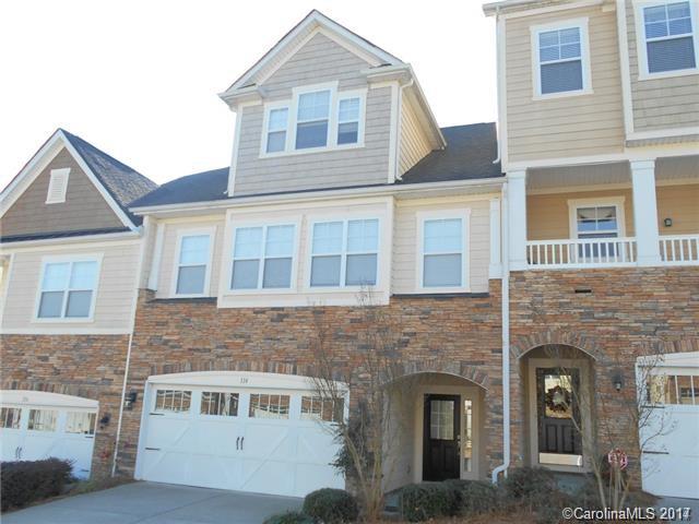 Executive 3 story Tega Cay townhome with 2 car garage, massive bonus room on 3rd level and a very short walk to Lake Wylie. Huge master suite with impressive walk in closet. 2 spacious secondary bedrooms. Stone Fireplace in great room with cherry bookshelves, formal dining space and breakfast area. Outdoor living off 3 levels with sundeck.  Neighborhood amenities include pool & playground. Great schools, shopping and restaurants