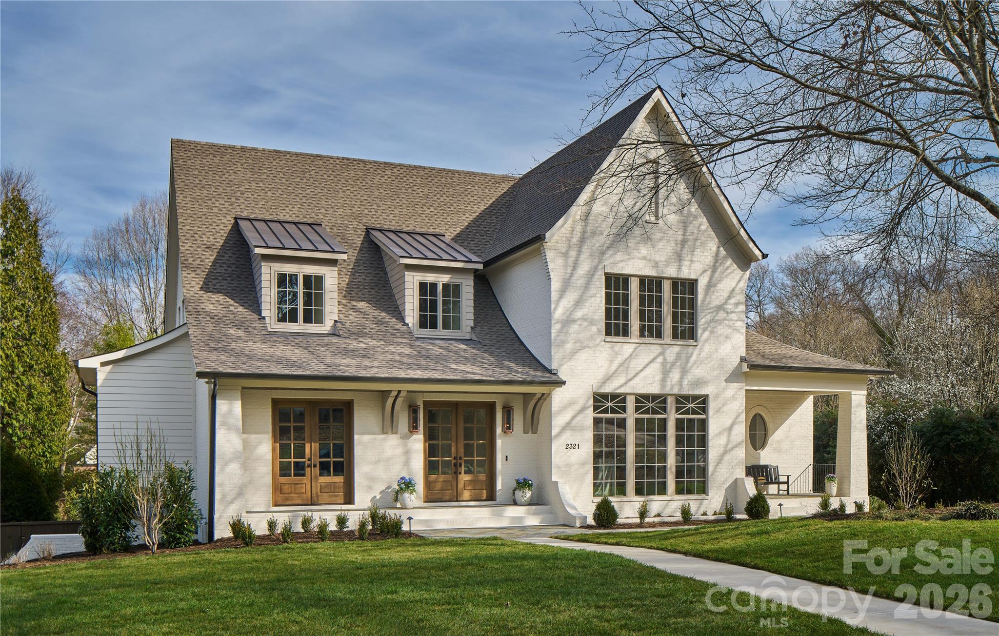 Another stunning home from THR Design Build.  Sitting on a beautiful 0.69-acre corner lot, this 5 BR, 5.5 BA home has it all.  This classic custom built gem is an entertainer's dream, with a heated salt water pool and spa.  Inside, you are greeted by french doors and 10' ceilings.  Classic dining room, office, a huge great room with fireplace, a chef's kitchen and pantry that you won't believe.  The primary suite is on the main floor and includes a vaulted ceiling with beams.  The primary bathroom and closet are out of this word.  A large screen porch, with fireplace, can be used year-round.  Upstairs you'll find 3 BR's with ensuite BA's and a spacious laundry room.  Lastly, the basement has 1 BR, 1 BA, a bonus room and tons of flex space.  This is, simply, a magnificent house.