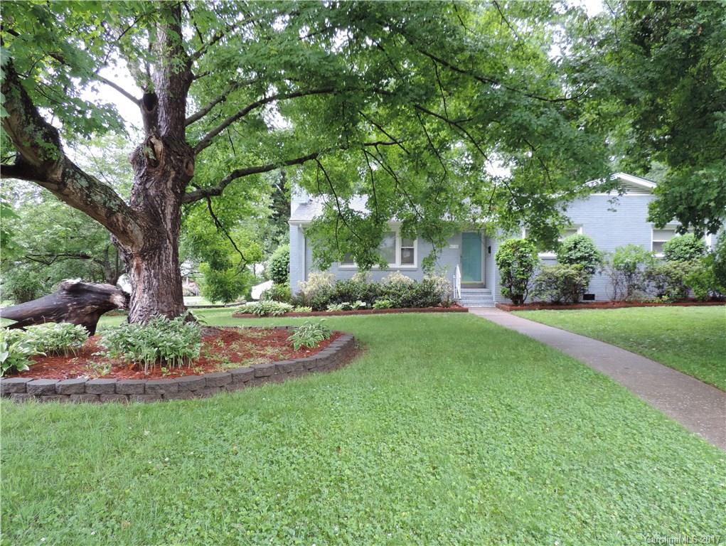 Immaculate brick home on a large corner lot! Stainless steel applicances, granite kitchen counter tops with center island. Beautiful wood flooring. Oversized walk in laundry room with washer and dryer included and built in shelving. Master bedroom with walk in closet. Living room has fire place. Small sun room for relaxing. Fenced in back yard. Great location.  Don't miss this stunning home. Must see!