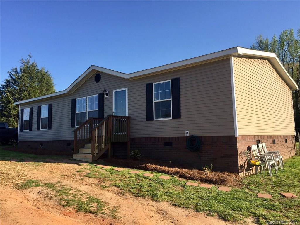 Welcome home to a private and quiet atmosphere located just outside of Rock Hill. This beautiful home sits on 1.75 acres, with a fully fenced in back yard. Inside hosts spacious bedrooms, a very open floor plan throughout, with like new laminate wood floors. If you are looking for country quiet living, this is it!