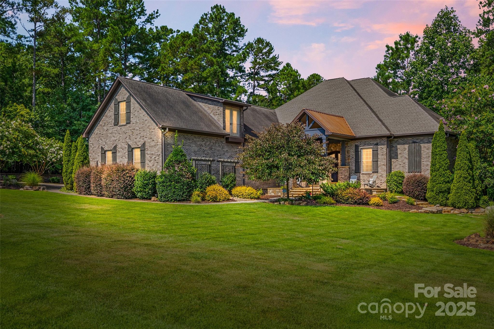 Welcome to this stunning home in Trinity Ridge. Perfectly situated on 1 acre in a quiet cul-de-sac, this 1.5-story home offers luxurious main-level living with thoughtful upgrades throughout. You'll find 4 spacious bedrooms on the main level, including a beautifully updated primary suite with a lighted tray ceiling, tiled shower, freestanding soaking tub, dual vanities and a private screened porch. The open-concept kitchen features a gas cooktop with pot filler, breakfast bar, large dining area and pantry. Elegant details shine throughout the home, from the coffered ceilings and built-ins to the cozy fireplace and formal dining room. Upstairs, enjoy a private guest suite with full bath and flex space. Exceptional outdoor living with a spacious screened porch with fireplace and dedicated half bath, a deck, brick patio and separate stone patio with pergola and wood-burning fireplace. Additional highlights include a huge laundry room with sink and a tankless water heater.