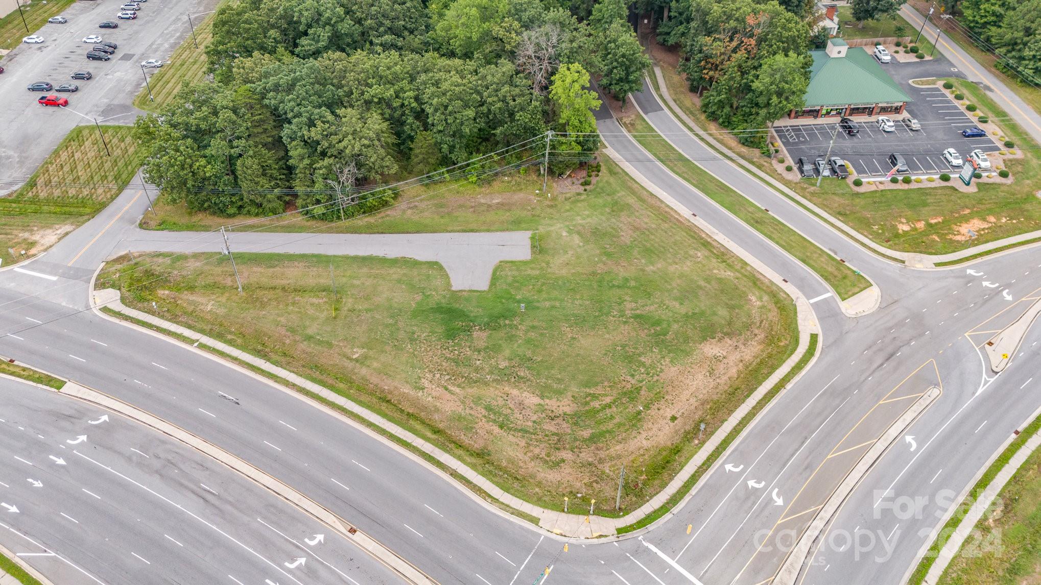 Prime Commercial corner lot for sale. Outstanding location on a busy crossroads with high traffic and maximum visibility. The lot is fully cleared and ready to develop. County utilities available by the road. Potential idea for a small retail property, ice machine or advertising banner. Can be rezoned to other commercial uses. Don't miss this opportunity to secure a prime piece of real estate in a bustling area. Perfect for business seeking high visibility and easy access.