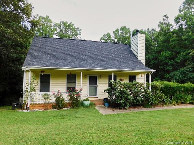 Cape Cod style w/bsmt surrounded by woods on each side of the lot. Welcoming entry from the covered front porch to the Great Room with wood burning fireplace. The sunny kitchen has newer tile floors and glass doors leading to large deck overlooking private backyard. Master on main w/private bath featuring dual vanities, WIC. Upstairs host 2 bedrooms and 1 full bath. Spacious 2 car garage in the bsmt with finished sunny Rec Room and 1/2 bath. Shed to remain.