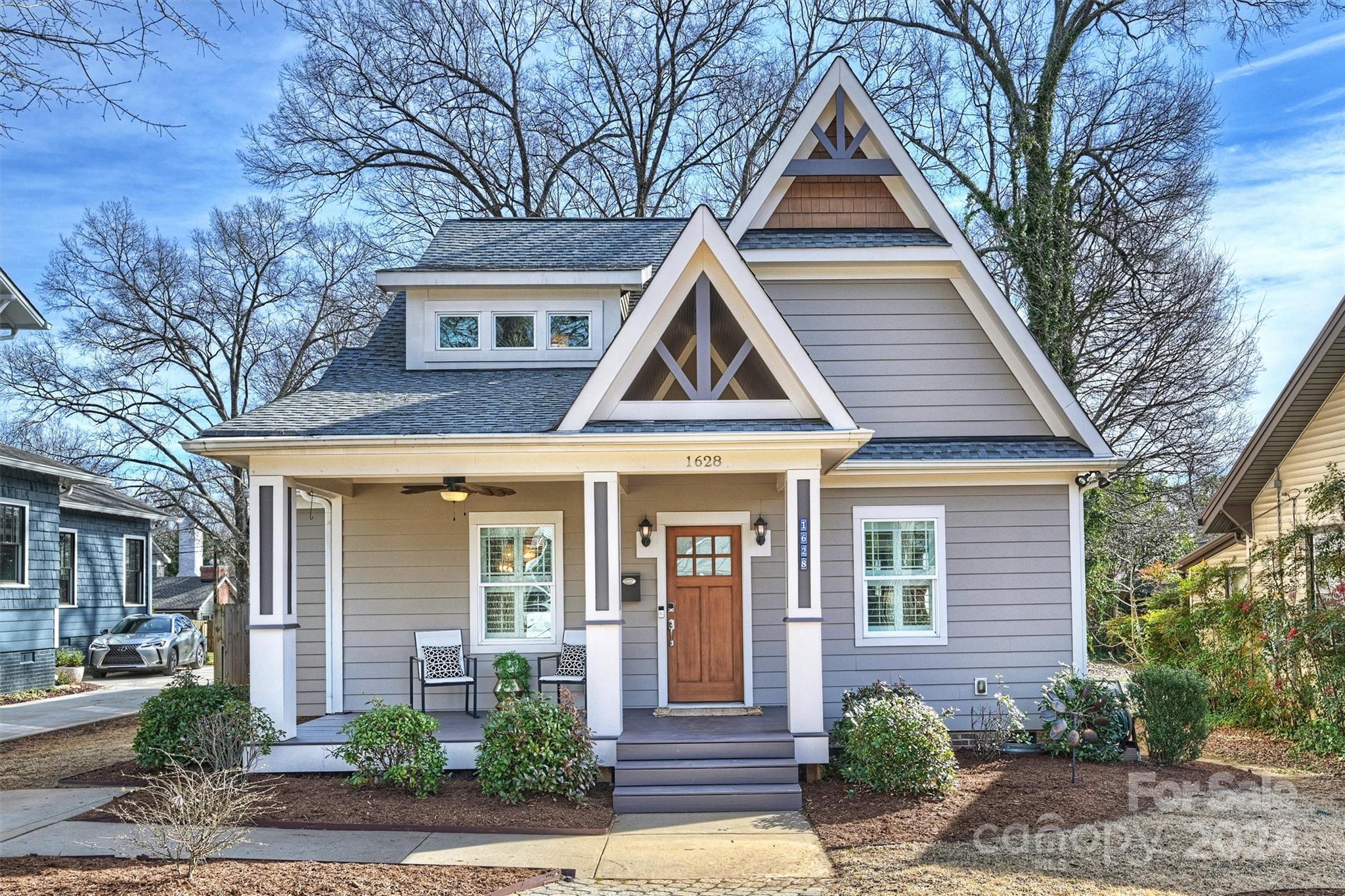 Your Dream Bungalow In Plaza Midwood Does Exist! This 2013-Built Craftsman Gem Boasts An Open Floor Plan With A Luxurious Primary Suite On The Main Level. Enjoy The Grand Two-Story Great Room With A Cozy Gas Fireplace And An Upstairs Loft Perfect For Your Home Office. Featuring Stunning White Oak Hardwood Floors, Granite Countertops, And Top-Of-The-Line Appliances In The Spacious Kitchen. Bathe In Beautifully Tiled Bathrooms With Dual Marble Vanities. Enjoy The Convenience Of A Tankless Water Heater, Ensuring An Endless Hot Water Supply. Step Outside To Your Outdoor Oasis, With A Covered Deck Equipped With Wired Electric Heaters, Promising Year-Round Enjoyment. Your Large Backyard Retreat Awaits, Complete With A New Fence, Illuminated By Fence And Landscape Lighting, A Cozy Fire Pit, And A Convenient Storage Shed. Experience The Ultimate In Walkable Living, With A Plethora Of Plaza Midwood Restaurants, Parks, And Breweries Just Steps Away!
