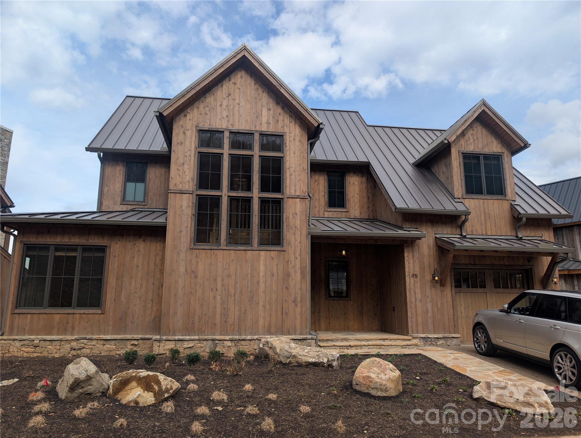 Beautiful new construction home built in the highly coveted Doubletop Village at Balsam Mountain Preserve.  Just minutes from all the action, this home boasts incredible long range mountain views, a covered porch with outdoor kitchen and plenty of room to entertain your friends and family.  Each generous en-suite bedroom has walk in closets and gorgeous custom bathrooms.  No detail was overlooked in the design of this home. Balsam Mountain Preserve is a private 4,400 acre club community with 3,200 acres of conservation land and completed amenities including an Arnold Palmer golf course, The Summit House and Mine Tavern restaurants, wellness and equestrian centers and over 40 miles of hiking trails.