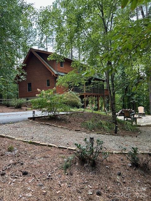Beautiful Mountain Log Home on 2.5 acres in private Lake Community. 2162 sq ft home, 1372 heated, 789 unfinished. This 2 bedroom, 2 full bath fully furnished and decorated log home is perfect for relaxing & entertaining. 3rd Bedroom can be easily added.  Hidden Lake is a restricted neighborhood featuring paved roads, gated entry, in-ground pool, pier, picnic area and scenic trails. Main level features living area, dining, kitchen, pantry, bedroom and bath - Wood floors, high ceilings and great views from inside or out. Upper floor has sitting area, bedroom, full bath -Great outdoor views. New Heat and Air 2026. Full unfinished basement with access to outside comes with freezer, washer/dryer, dog wash, 2nd dryer, storage shelves - finish as you wish.  Outdoor scenic dining on 2 levels plus covered outdoor dining with grill and large screened in porch overlooking firepit.  Outdoor storage shed for mower and golf cart. 
Airports:  Asheville Airport - 1 hour; Greenville SC & Charlotte 1 1/2 hours.
Property Rental Information included.