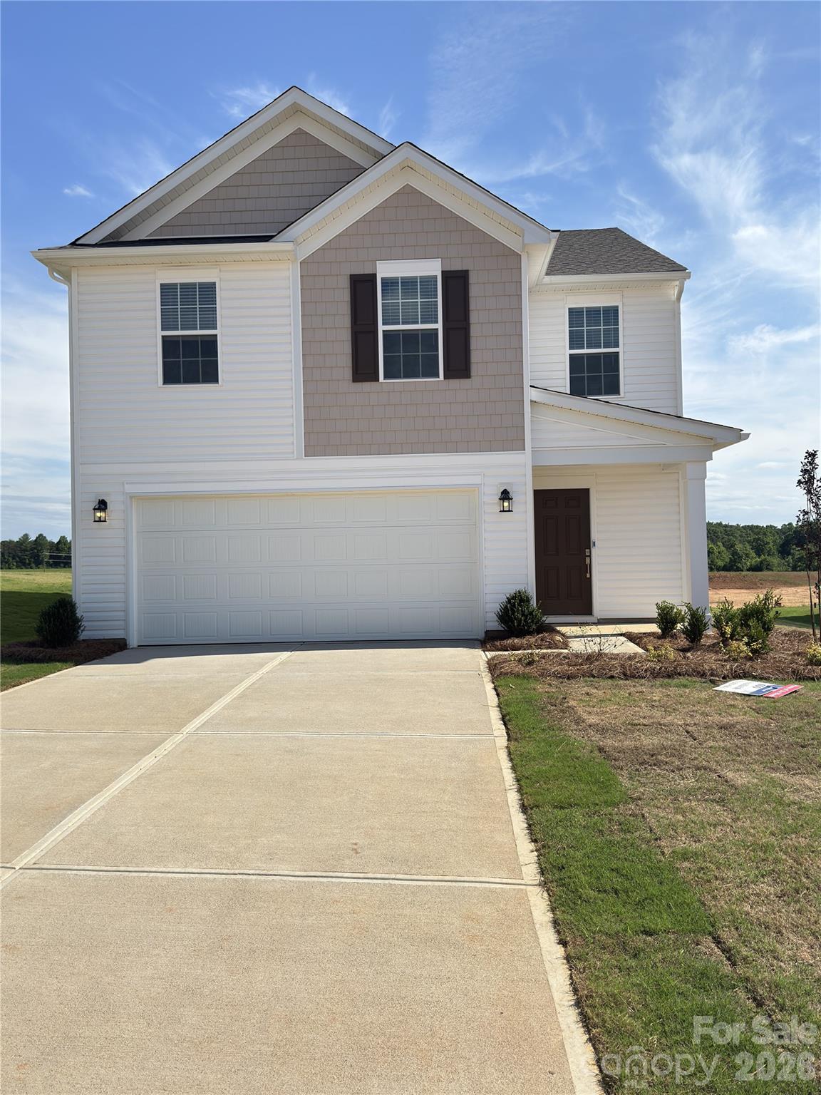 This new two-story Whitman floorplan showcases an elegant design with ample room to grow and entertain. The first floor is host to an inviting shared living area consisting of the kitchen, living and dining areas. Three bedrooms can be found upstairs, including the luxe owner’s suite, and a versatile loft offers a shared living area. A two-car garage completes the home. Plus, our signature Everything's Included program means you will get quartz or granite kitchen countertops, stainless steel appliances, luxury vinyl plank flooring, fridge, washer/dryer, blinds, and so much more at no extra cost! Oxford Glen will offer a picnic pavilion, playground, and walking trails to help foster a sense of community.  Discover the charming location in Claremont, nestled between Hickory and Statesville.  Ask about our special financing incentives available through our preferred lender.