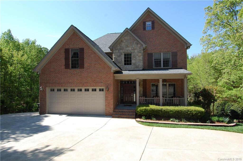 Amazing dream home located in sought after Tega Cay! Rich hardwood flooring throughout the main level! Formal living & dining rooms! Kitchen boasts flowing granite countertops, high end SS appliances, & large island! Great room features custom built in cabinetry! Fully finished basement featuring your own private theater, exercise, & rec rooms! The amazing balcony deck overlooking your private oasis offers an outdoor kitchen & view of dual fire pits! The detached garage boasts an in-law suite!