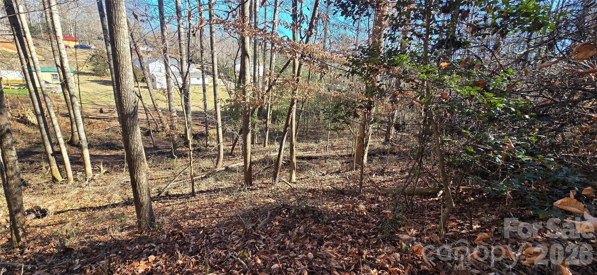 Manufactured homes allowed AND has a creek! Two lots included in this sale for a total of 1.75 acres. City water and sewer. Doublewide manufactured or modular homes permitted. Zoned R-6 in city of Lenoir. City and county taxes. Minimum setbacks are 35 feet from the front (road), 25 feet from the back line, and 10 feet from the sides. Has a little creek at the bottom of the lot.