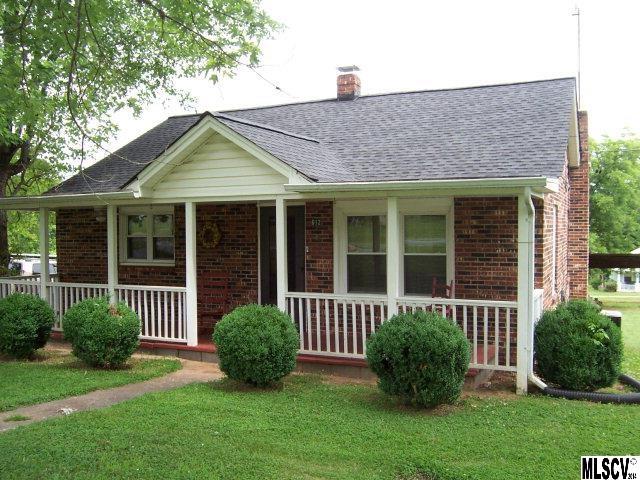 Brick veneer two bedroom one bath home on large lot. Replacement windows. Wood laminate flooring. Very large detached workshop/garage/storage building. Deed states site size as 0.75 acre and tax records state site size as 0.66 acre.