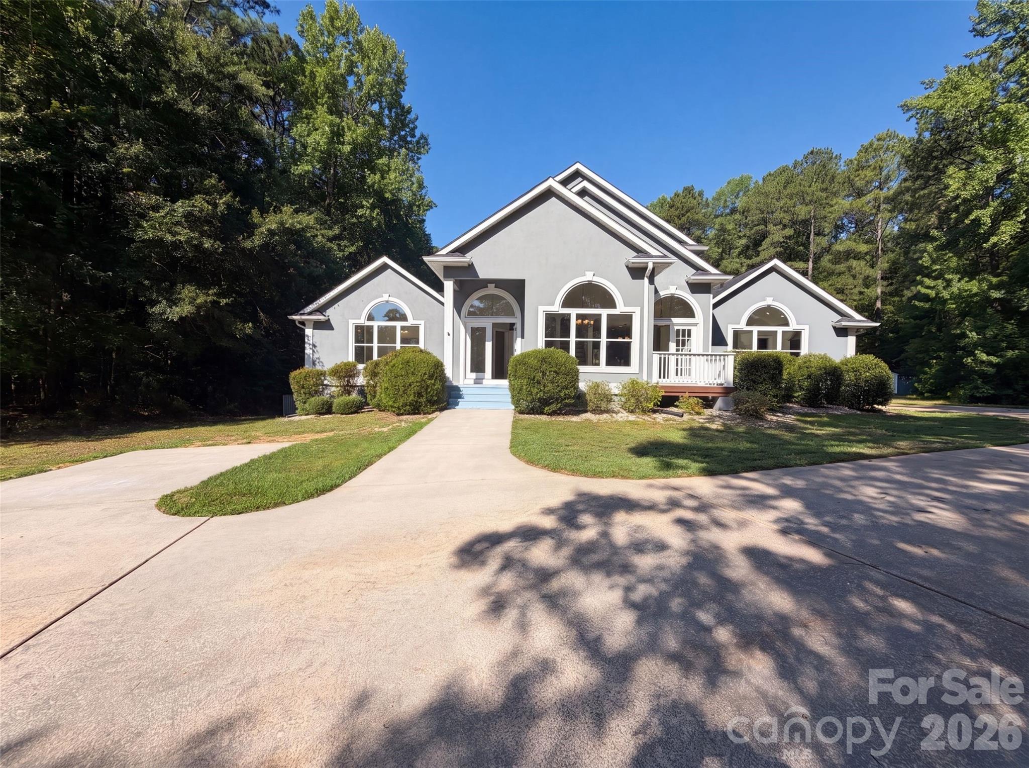 502 Live Oaks Ct is a one-story Fort Mill cul-de-sac home with a functional layout and modern finishes throughout. The kitchen features a center island, stainless steel appliances, granite countertops, and a walk-in pantry, creating a fully equipped space for cooking and entertaining. A fireplace anchors the main living area, adding warmth and ambiance to the central gathering space. The primary bedroom includes a spacious walk-in closet for convenient storage and organization, while the primary bathroom features a separate tub and shower for everyday convenience. A patio extends the living space outdoors, overlooking an in-ground pool set within a fully fenced backyard that creates an expansive area for relaxation and entertaining. This residence combines practical design with comfortable living spaces, delivering functional amenities throughout every room.. Included 100-Day Home Warranty with buyer activation