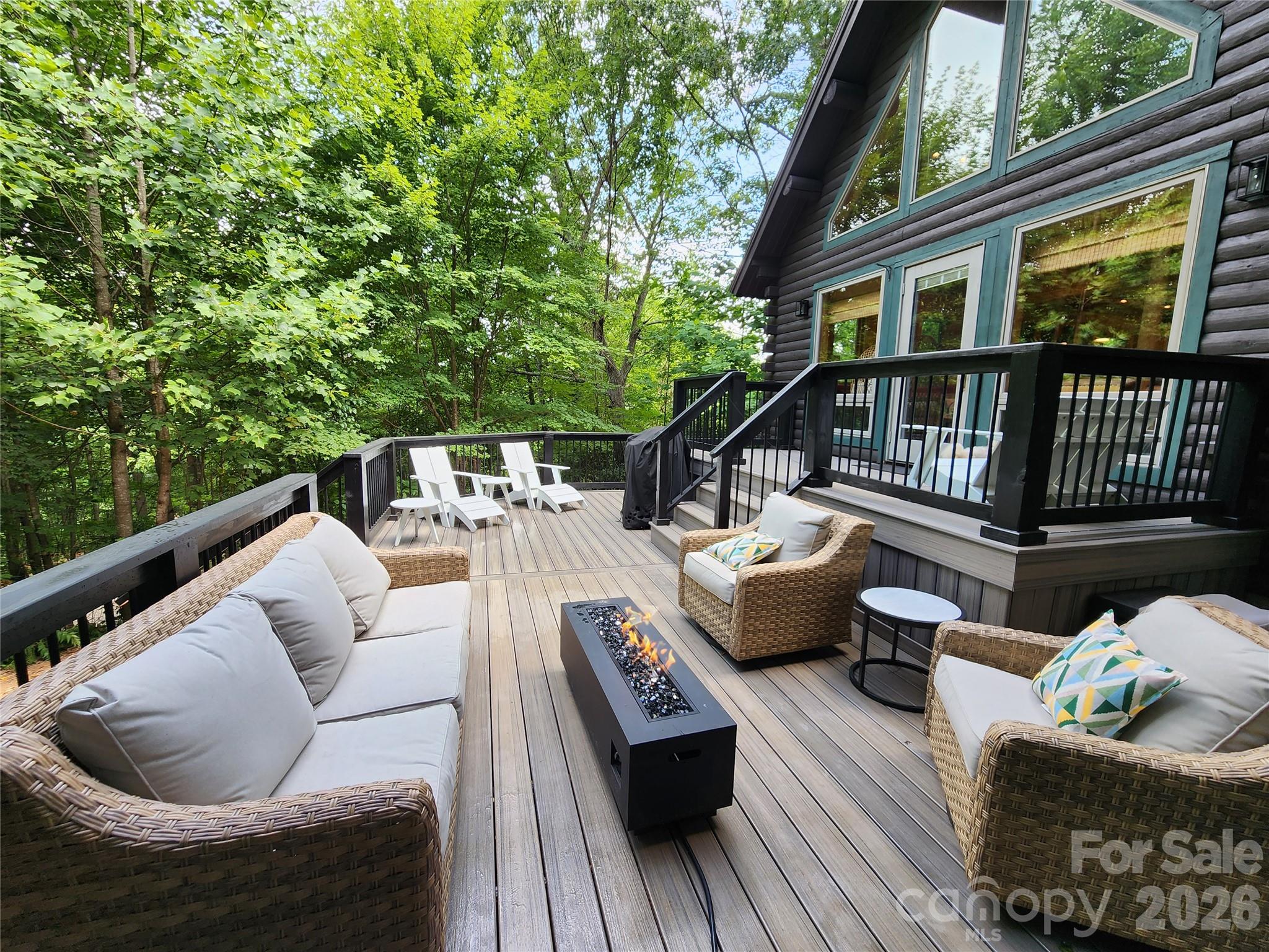 Welcome to “The Treehouse” — a refined mountain retreat in the heart of Lake Lure. Wrapped in classic Dlog siding and constructed on a solid Superior Wall foundation, this inviting home seamlessly blends rustic character with modern comfort. Thoughtfully updated and truly turnkey and move in ready, it features all-new flooring throughout, including durable LVP on the main level and bamboo engineered hardwood upstairs. Enjoy seasonal peek-a-boo winter views of Lake Lure and effortless outdoor living on the newly expanded Trex deck—perfect for entertaining under the stars. Recent improvements, including a new well pump and hydrofracked well, provide added peace of mind, while stylish lighting, a beautifully refreshed bathroom, and modern upgrades elevate the home’s overall appeal. Whether you’re seeking an income producing short-term rental investment or a private mountain escape, “The Treehouse” offers a rare combination of charm, quality, and move-in-ready convenience in this fully furnished retreat just in time to enjoy the opening of Lake Lure!