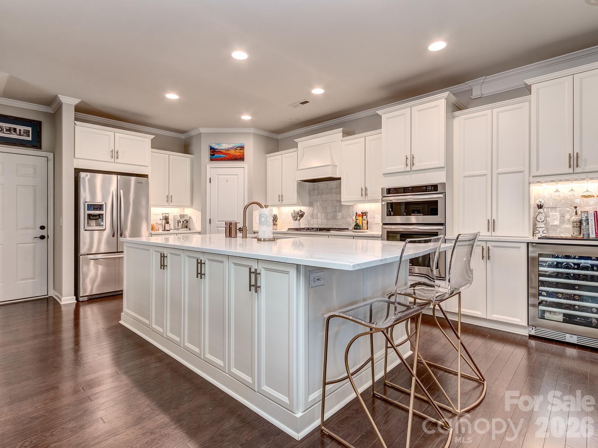 Welcome to this spacious 3-bedroom, 3.5-bathroom home in the gated community of Park South Station. Offering nearly 2,600 square feet, this thoughtfully designed floor plan features a private ensuite bathroom for each bedroom. The Primary bedroom is complete with dual walk in closets and a flex space perfect for an office or seating area, with direct access to a private balcony.

Located on a quiet dead-end street with extra parking, this home enjoys a desirable setting with convenient access to additional parking nearby. The kitchen has been tastefully updated, while a dedicated bar area creates the perfect space for entertaining. The exterior spaces include a partially covered and extended back yard patio and fenced back yard. Yard maintained by the HOA. 

Residents of Park South Station enjoy access to a community jr. olympic swimming pool, clubhouse, fitness center, tree-lined sidewalks, dog park separated by large and small dogs, a playground, a recreational green space, direct access to the little sugar creek greenway, and an active social committee with regular food truck rotation and quarterly events. All of this just minutes from SouthPark, the Light Rail, shopping, dining, and major commuter routes.

Combining space, privacy, and, an exceptional location, this home offers an outstanding opportunity in one of South Charlotte's most sought-after communities.