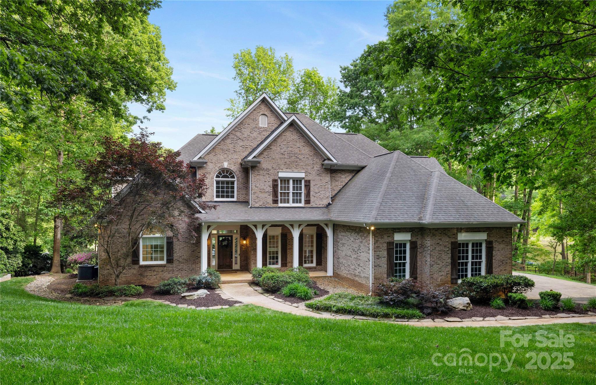 Storybook charm meets sophistication on a secluded 1+ acre waterfront lot in a beautifully established community. Expansive windows bring serene views of a private pond and charming footbridge.

Renovated in 2018 and 2023, the home features a stunning kitchen with sizable island, double ovens, and smart appliances. A 2023 structural renovation added a butler’s pantry, and dedicated laundry and mudrooms, and a reimagined primary bath.

The primary suite offers his and her closets, and spa-inspired bath with heated limestone floors, soaking tub, oversized shower, makeup corner, and double vanity.

Quartz countertops throughout emulate marble and soapstone. Custom woodwork, paint, and lighting are featured.

More highlights: Media room with built-in entertainment center. Trex deck with outdoor kitchen, water filtration, security system, a 3-car garage equipped with EV charging, French drains, and lake-fed irrigation.