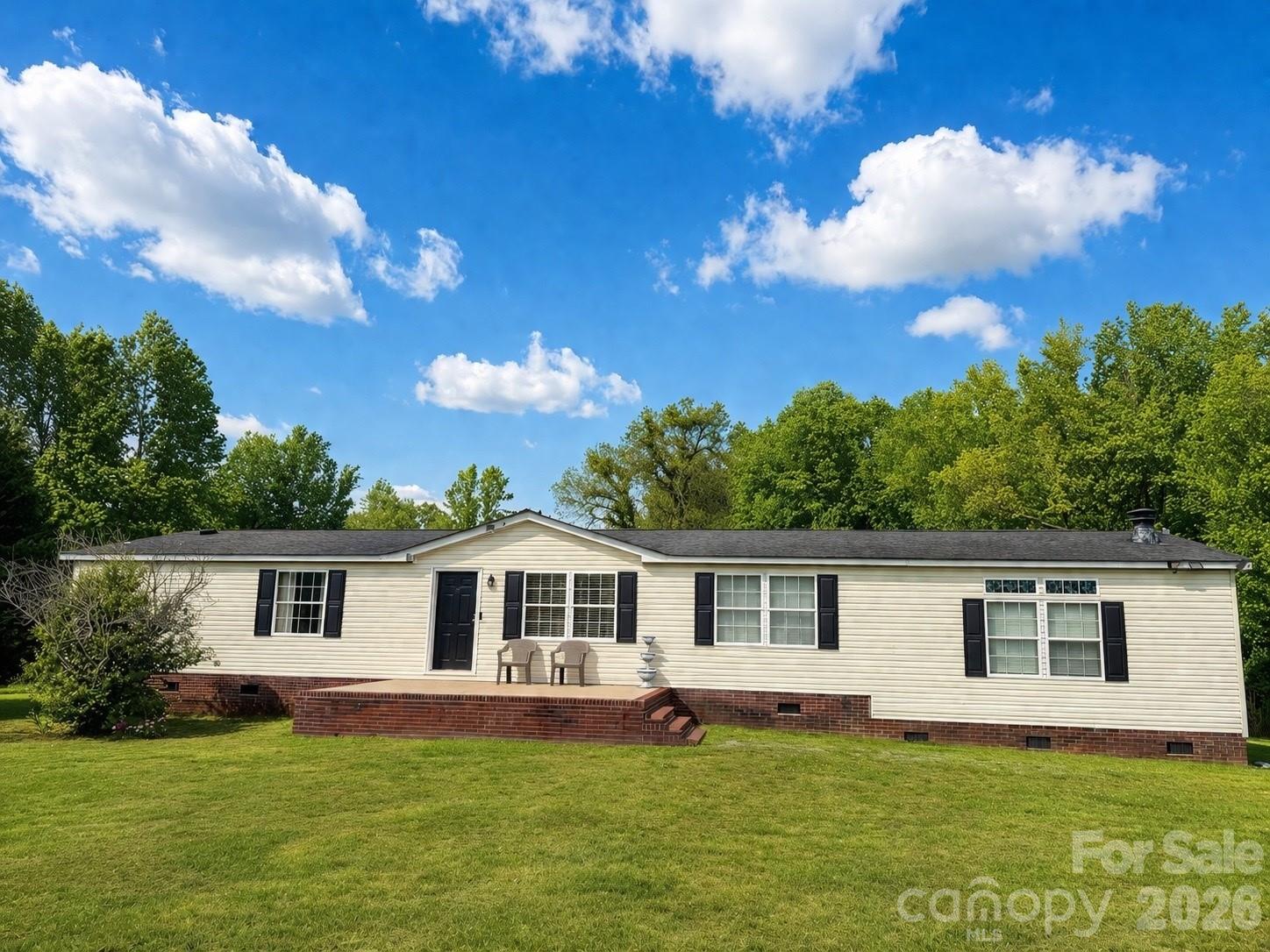Enjoy the perfect blend of space, privacy, and natural beauty! This 3 bedroom, 2 bathroom home offers 3.5 acres of endless possibilities-gardening, workshops, expansion, etc. A peaceful creek runs through the backyard creating a tranquil backdrop for your morning coffee or evening strolls. Property includes an outbuilding, a lean-to for lawnmower or equipment storage, and a ready-to-use chicken coop. The heart of the home features a large, open kitchen with ample cabinet space, skylights for natural lighting, and a large island-perfect for gatherings. The spacious primary bedroom features double closets and a en suite bathroom with a double vanity. 
Come experience the serenity of country living-schedule your showing today!