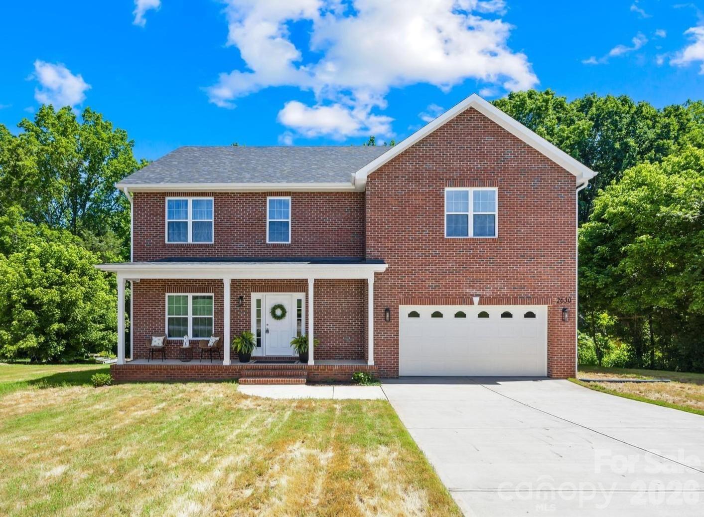 Looking for something beyond the typical new construction? Unlike many production-built homes, this full brick home offers more than 2,500 square feet of flexible living space on a generous .68-acre lot, with 3 bedrooms, 3 full baths, a dedicated home office, two spacious lofts, and a two-car garage. Whether you need a playroom, home gym, media room, homeschool space, or guest retreat, this versatile floor plan is designed to grow with you.

At the heart of the home, the open kitchen and living area creates an inviting space for everyday living and entertaining. The oversized island naturally becomes the gathering place, while abundant cabinetry provides exceptional kitchen storage. Quartz countertops, stainless steel appliances, flat-panel soft-close cabinetry, crown molding, encased windows, detailed trim work and generous closet space throughout create a home that's both beautiful and functional.

Upstairs, the bedrooms and loft spaces are tucked away from the main living area, creating separation between where you gather and where you recharge. The spacious primary suite features a tray ceiling, recessed lighting, dual vanities, and a fully tiled walk-in shower with a frameless glass enclosure.

Step outside and enjoy one of this home's best features: an expansive Trex deck with peaceful wooded views, creating the perfect setting for morning coffee, weekend cookouts, or relaxing after a long day. Combined with the covered front porch and spacious yard, this property offers the breathing room that's becoming increasingly difficult to find in newer construction communities.

Conveniently located just minutes from Highway 321 and I-40, you'll enjoy easy access to Hickory, Lincolnton, Denver, Charlotte, and Lake Norman while coming home to a little more space and a quieter pace of life. Spend your weekends exploring area favorites like Riverbend Creamery, Mountain Creek Park, Red Wolf Farm, Maiden Splash Pad, and Grounded Coffee.