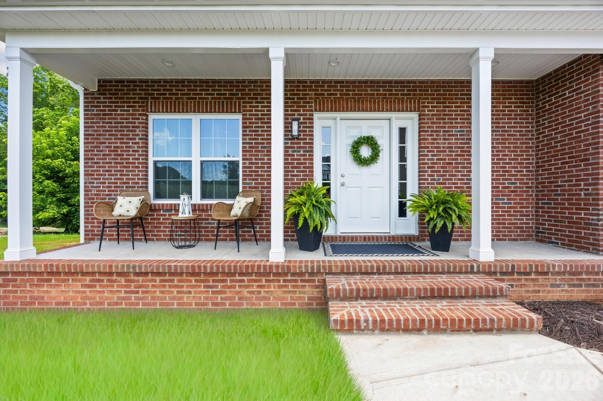Looking for more than the typical new construction floor plan? This custom-style full brick home offers 2,500+ square feet offers 3 bedrooms, 3 full baths, dedicated office space, two-car garage, & two loft spaces that give you room to adapt as life changes: playroom, gym, or media room you decide.

The main level is designed for everyday living, with an open kitchen & living area that keeps everyone connected while still providing space to spread out. The oversized island creates a natural gathering place, while quartz countertops, stainless steel appliances, flat-panel soft-close cabinetry, crown molding, encased windows, & detailed trim work add quality & character throughout the home.

Upstairs, the bedrooms & loft spaces are tucked away from the main living areas, creating separation between where you gather & where you recharge. The primary suite features a tray ceiling, recessed lighting, dual vanities, & a fully tiled walk-in shower with frameless glass surround.

Outside, the covered front porch, large Trex deck, wooded backdrop, & .68-acre lot offer something that's becoming harder to find in newer construction: a little less of the crowded subdivision feel.

Move-in ready & easy to show. Convenient to I-40, Highway 321, Denver, Hickory, Lake Norman, the Apple facility, Jacob Fork Park, and Riverbend Farm, offering an easy commute & a slower pace of life when the workday ends.