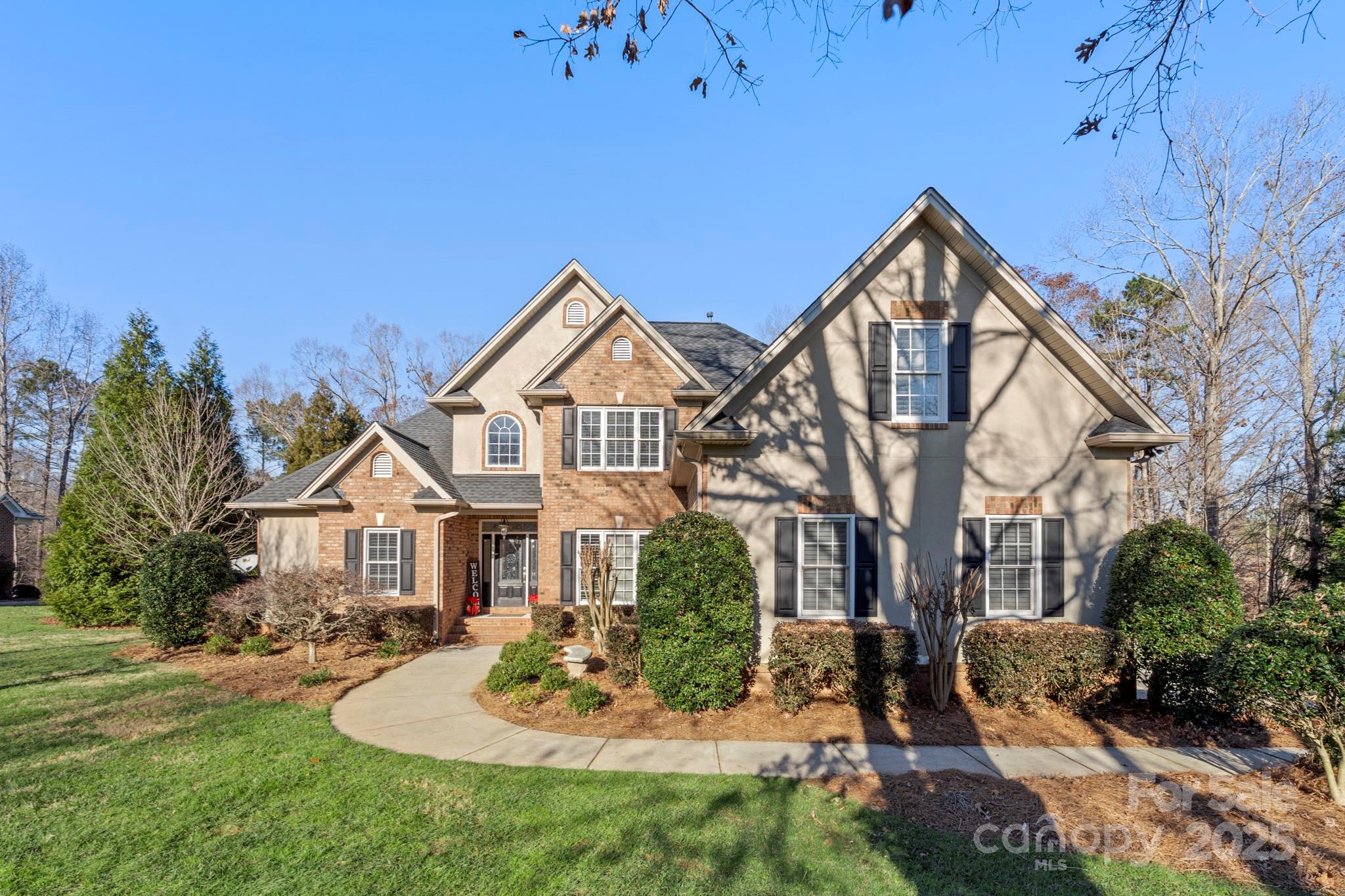 Luxury meets leisure at this beautiful custom full-brick home on Lake Wylie nestled in the confines of Masons Crossing on 1 Acre. Prepare to fall in Love with this oasis providing access for small boats, (Jon Boats, Canoes, and Kayaks. Gourmet kitchen, Sub-Zero fridge, SS appliances, warming drawer, Miele espresso machine, Cherrywood built-ins, hardwoods, exquisite travertine tile, granite & quartz countertops, updated 2nd bathrooms, freshly painted rooms, and dual wine cabinets. Impressive stone work surrounds the fireplace and the vaulted ceiling with skylights! Lounge outdoors on the huge weatherproof Trex deck, or on the impressively designed paver patio overlooking the lake! Conveniently located in the top rated Clover School District, and near retail shops, restaurants, and more! NO HOA.