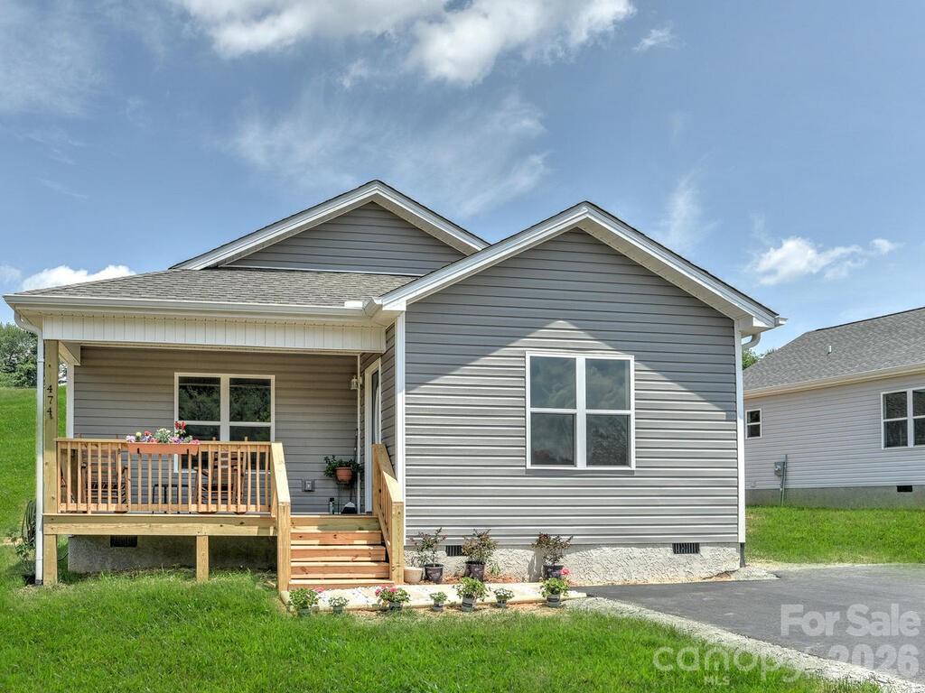 Escape the traffic come be a part of small town life just 20 minutes to downtown Asheville. New construction in  conveniently located new home community in Mars Hill. This site built home offers open floor plan, luxury waterproof vinyl plank flooring throughout, granite counter tops, stainless appliances, 2x6 exterior walls, and a front porch perfect for rocking chairs.  The community offers paved roads, high speed fiber optic internet, green space and all city services, including water/sewer, free trash pickup and free curbside recycling. Close to schools, restaurants and shopping. Homes are USDA and VA approved.  Taxes to be determined. Photos are representative.