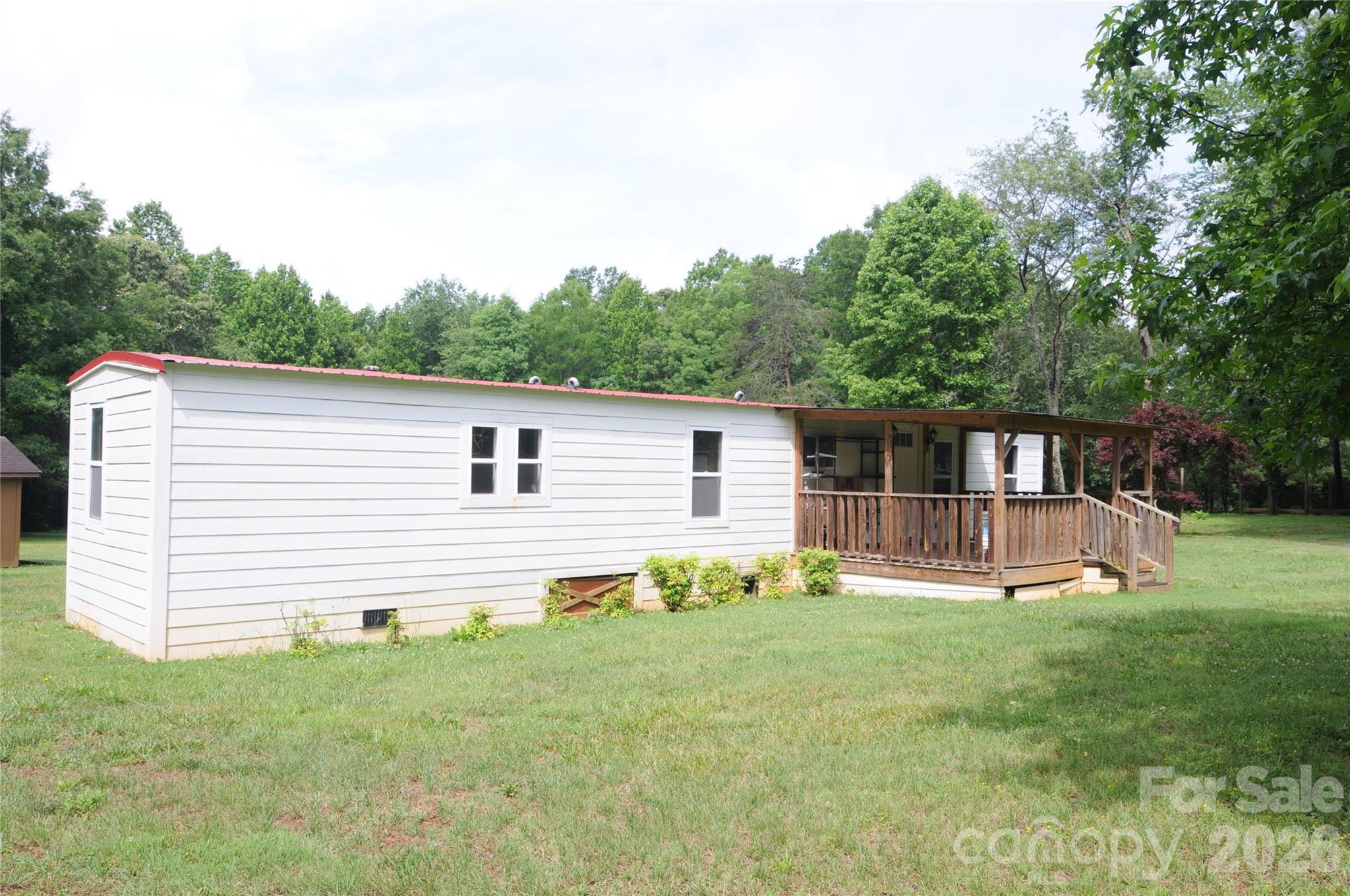 Come and make this your home! 3 bedroom one bath singlewide waiting for you to finish the final touches to make it your own. nice fromt covered porch and peacefull setting close to town.