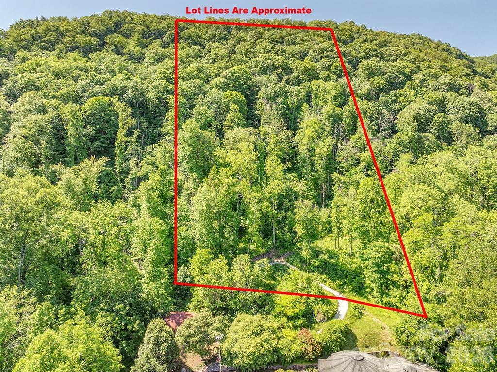 Million dollar views for a fraction of the price!  Photos have been updated to show both the summer and winter landscape.  This private lot is perched at the top of the small, quiet Patchens Mountainside Forest Estate neighborhood.  With sweeping, long range northeast mountain views, this beautiful 4 acre parcel offers incredible value with a cleared, leveled build site, newly paved driveway, updated and recorded survey, and 3BR septic permit (through May 2027).  A short drive to shopping along 276 and downtown Waynesville, this lot offers a peaceful retreat while conveniently close to town.